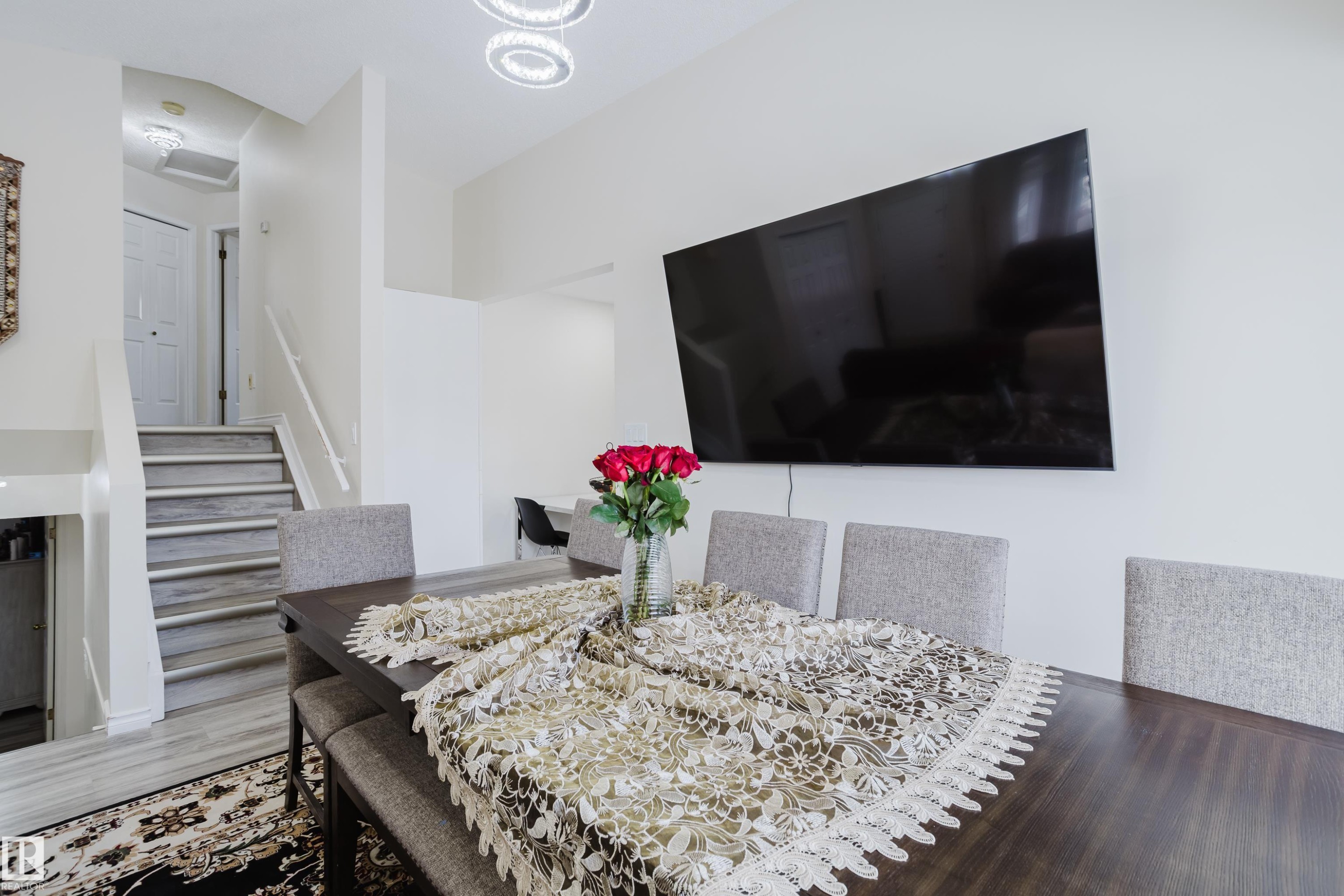 Dining area featuring stairs and wood finished floors - 236 Lago Lindo Crescent, Edmonton, AB - Indoor Photo Showing Dining Room