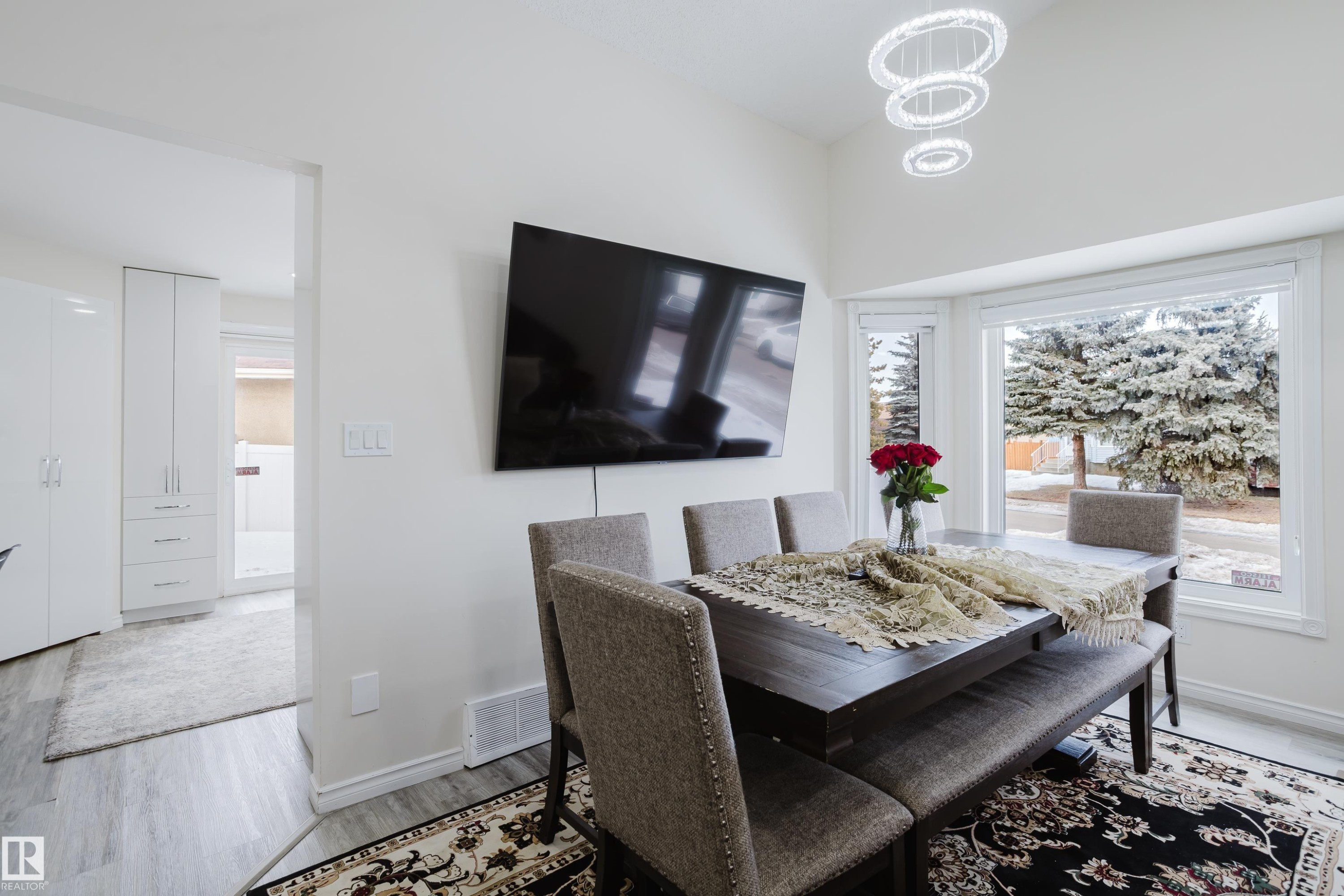 Dining room featuring light wood-style floors and a chandelier - 236 Lago Lindo Crescent, Edmonton, AB - Indoor Photo Showing Dining Room