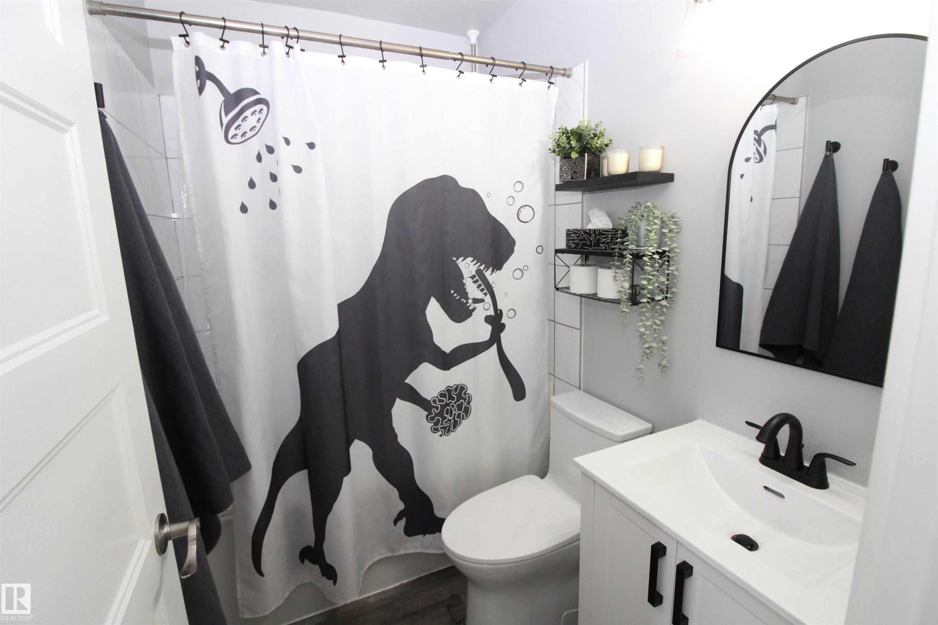 Bathroom featuring vanity and curtained shower - 10319 106 Ave, Westlock, AB - Indoor Photo Showing Bathroom