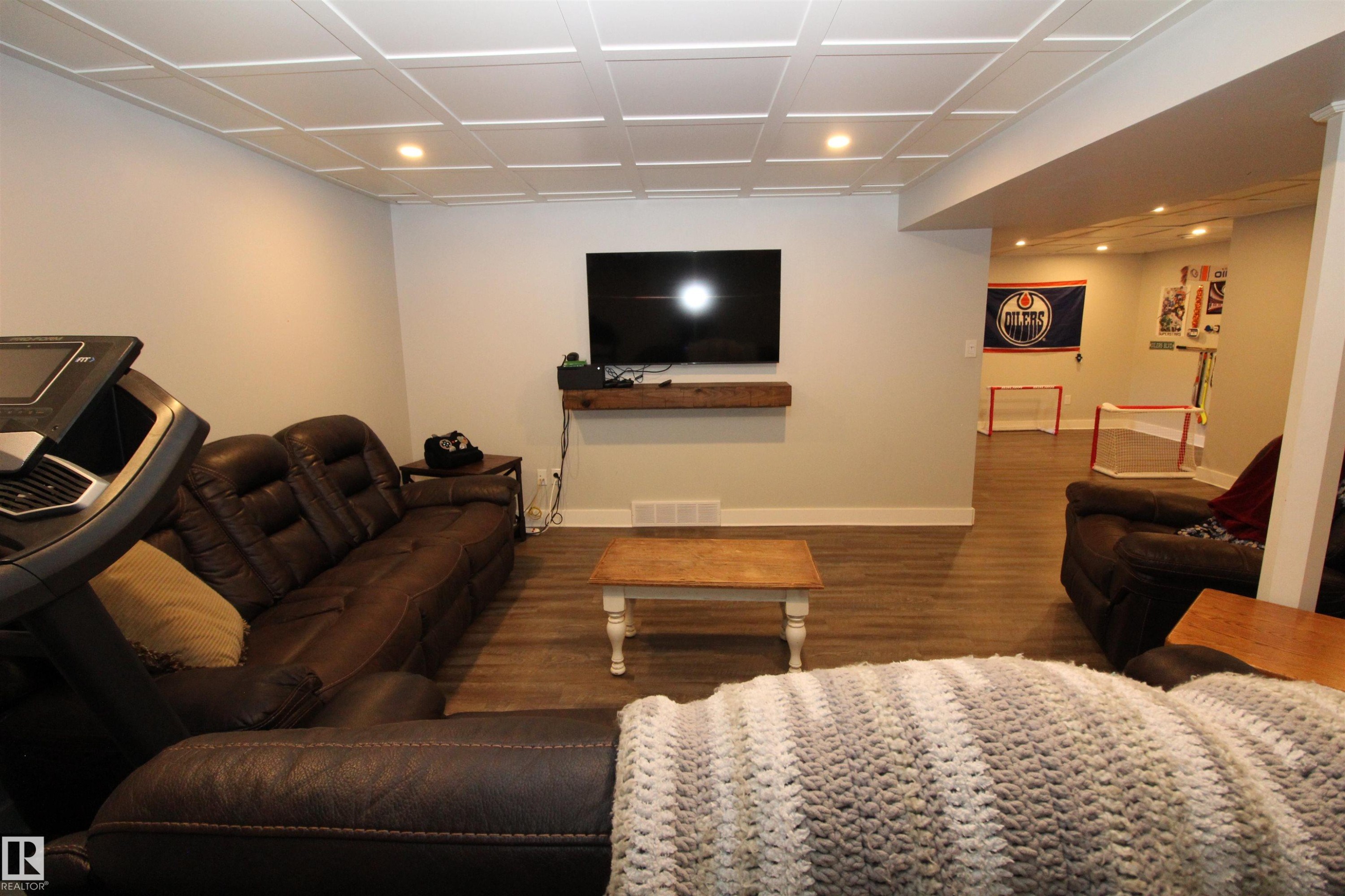 Living room with wood finished floors and recessed lighting - 10319 106 Ave, Westlock, AB - Indoor