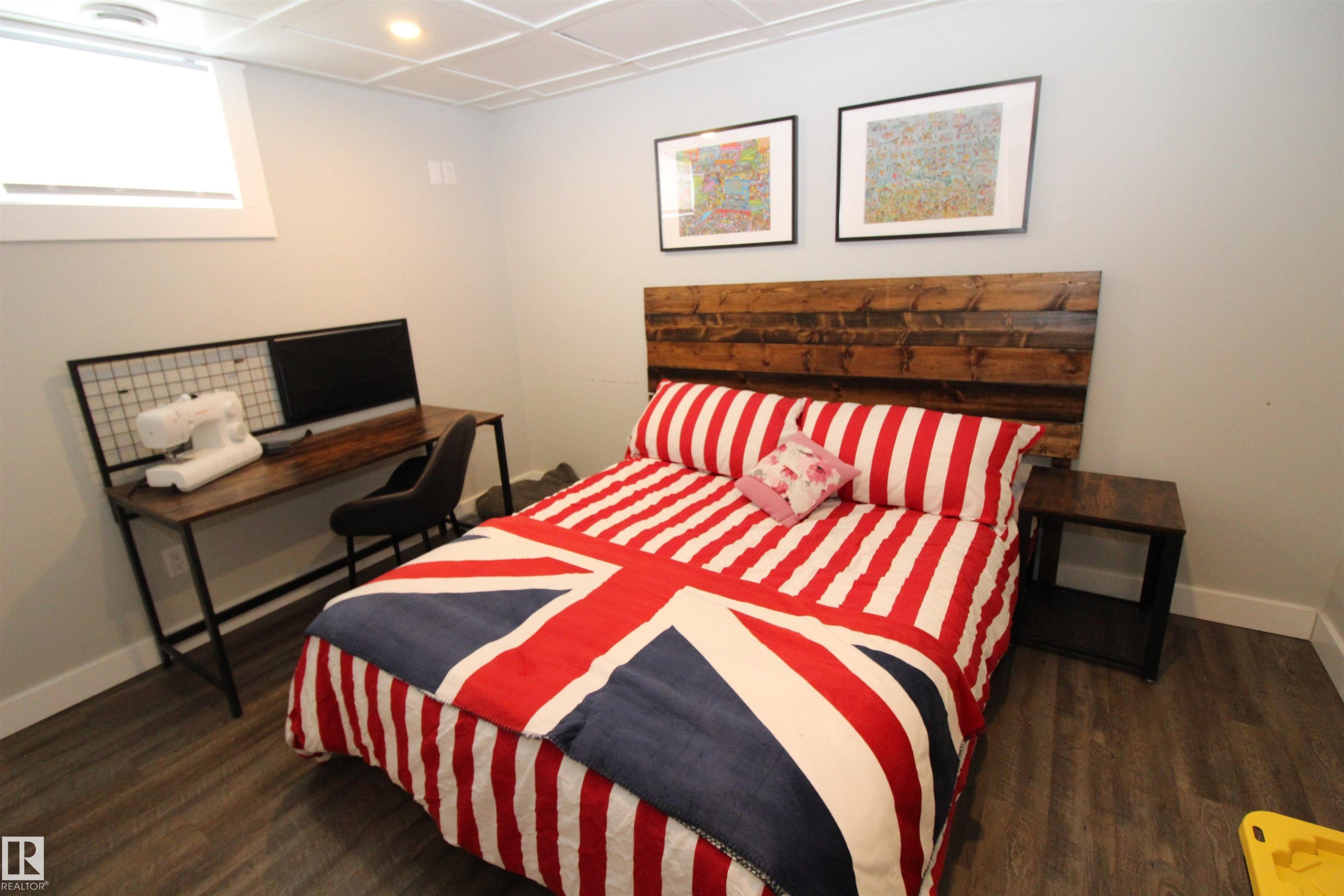 Bedroom featuring dark wood-style flooring and recessed lighting - 10319 106 Ave, Westlock, AB - Indoor Photo Showing Bedroom