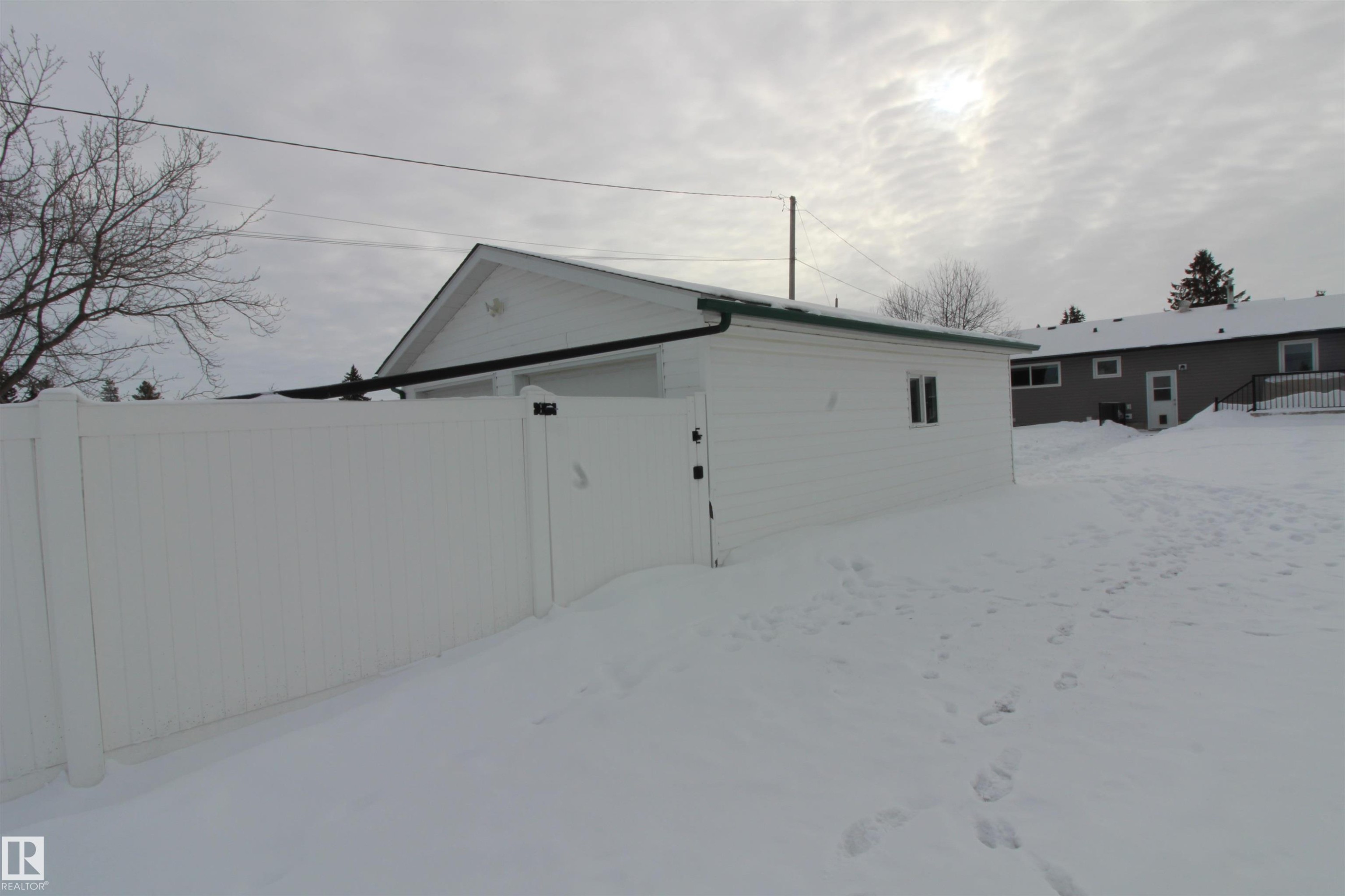 View of side of property with a gate - 10319 106 Ave, Westlock, AB - Outdoor