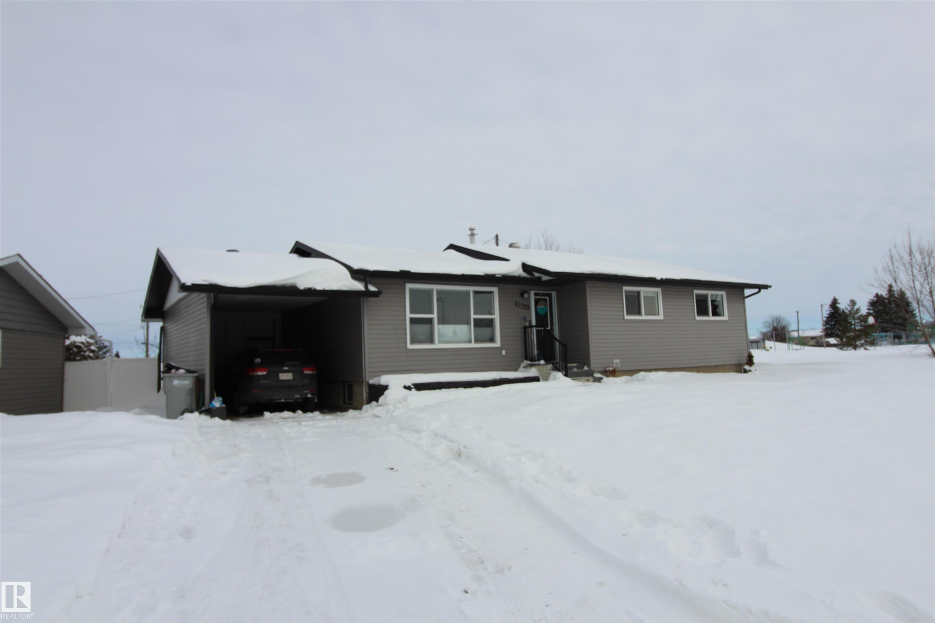 View of snow covered house - 10319 106 Ave, Westlock, AB - Outdoor