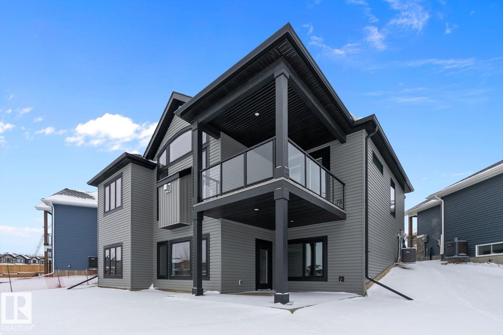 Snow covered property - 128 Lilac Close, Leduc, AB - Outdoor