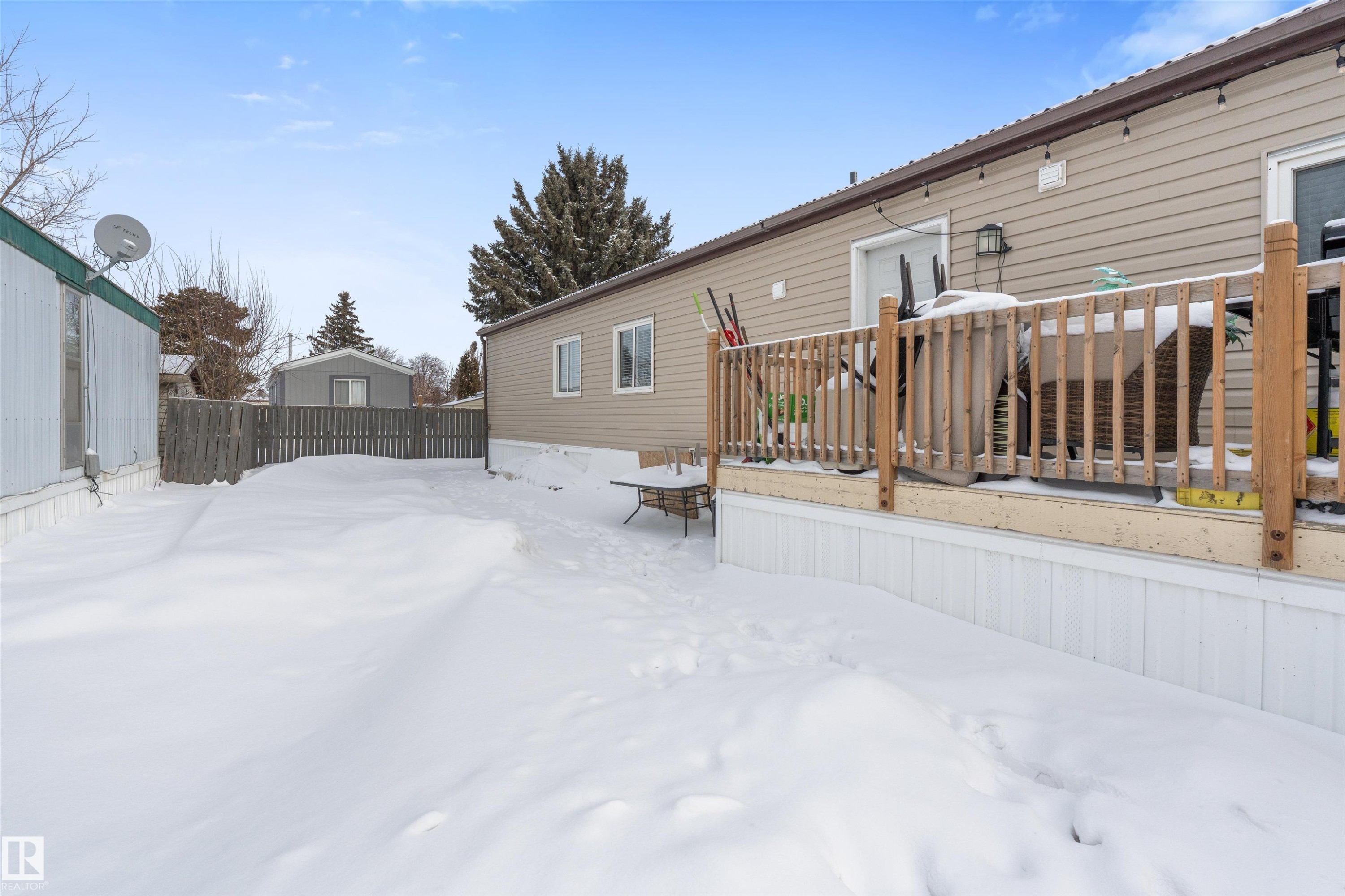 Yard layered in snow with a deck - 56 Westview Boulevard, Edmonton, AB - Outdoor With Exterior