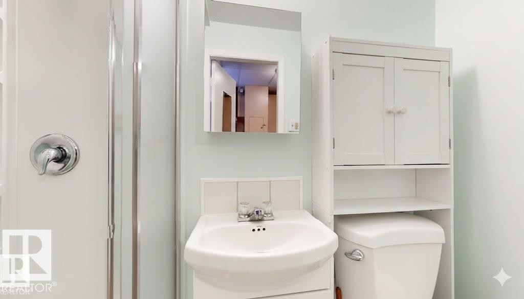 Bathroom featuring a stall shower and vanity - 4706 53 St, Leduc, AB - Indoor Photo Showing Bathroom