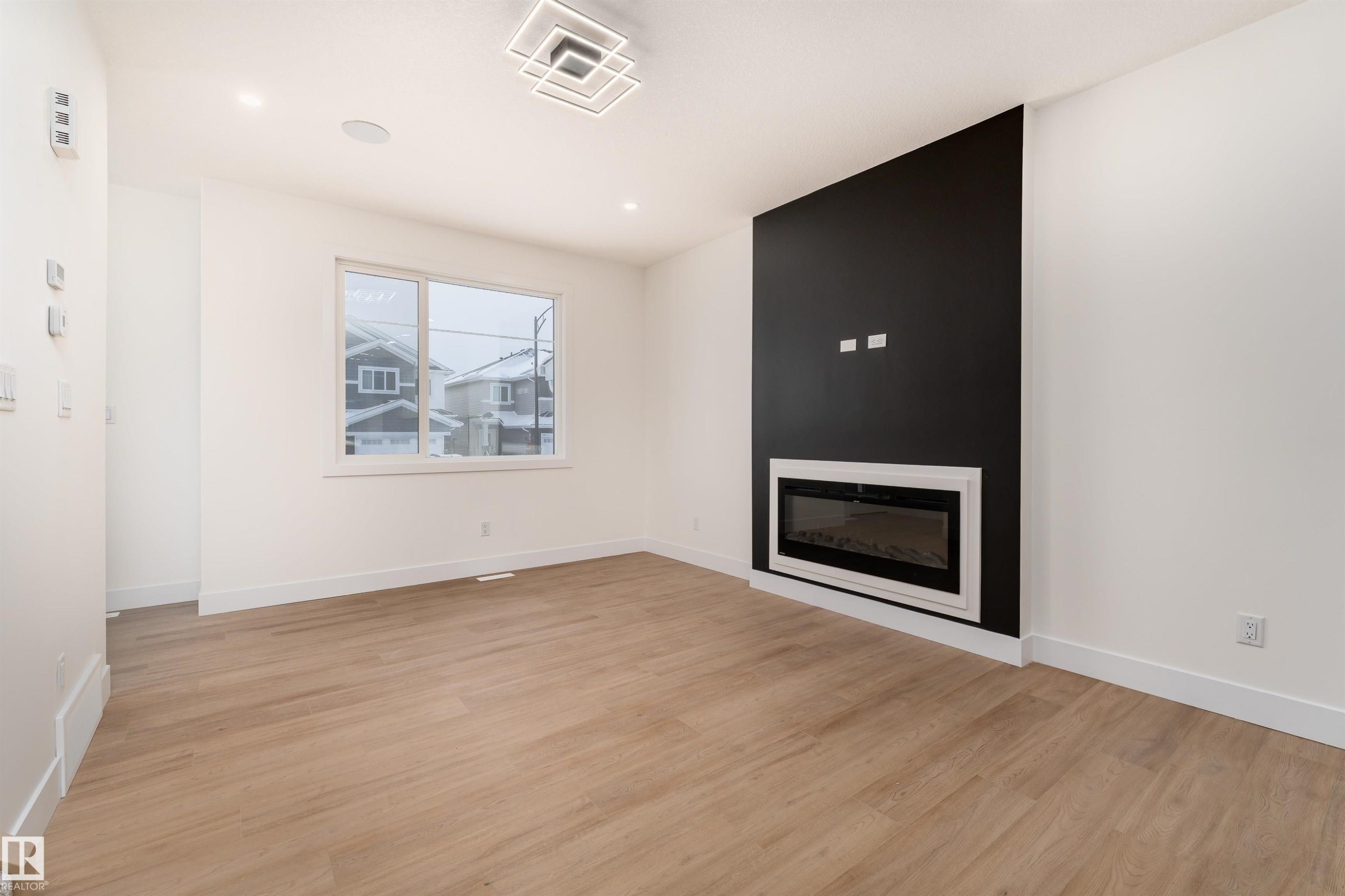 3103 Magpie Way, Edmonton, AB - Indoor Photo Showing Living Room With Fireplace