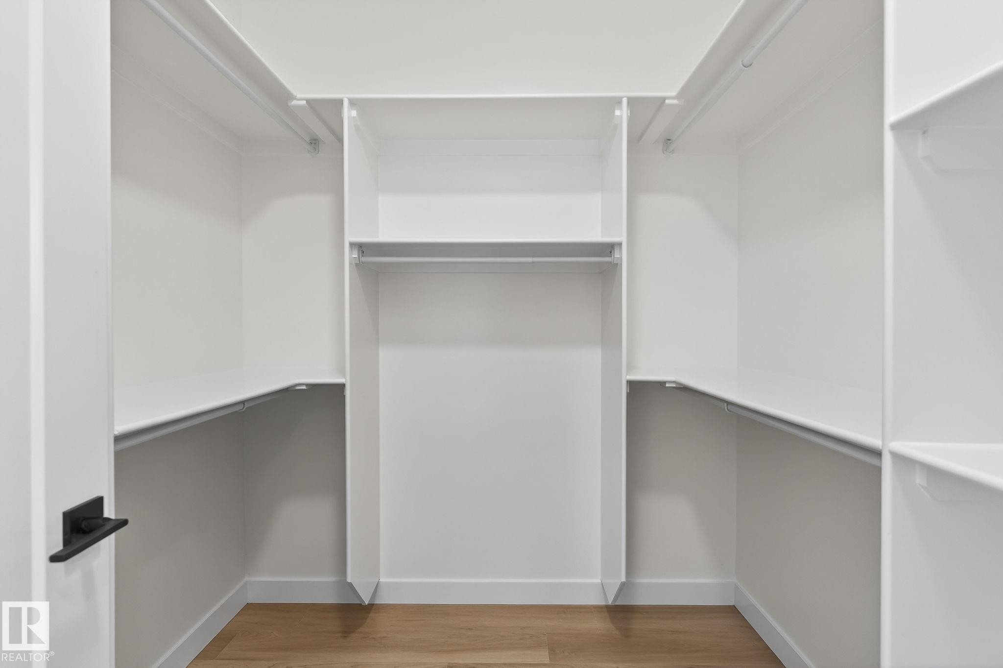 Walk in closet with light wood finished floors - 3318 Chickadee Drive, Edmonton, AB - Indoor With Storage