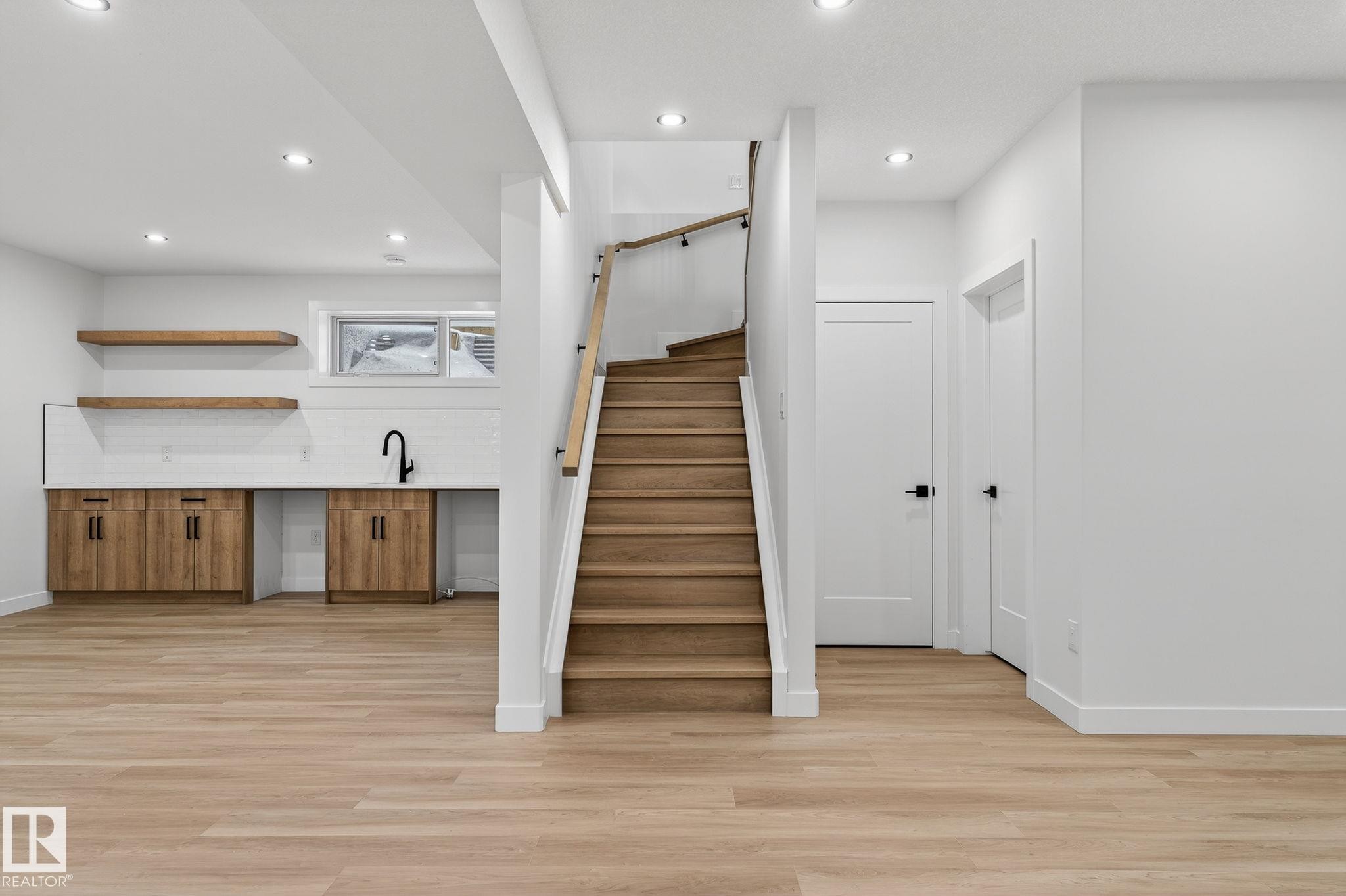 Stairs featuring wood finished floors and recessed lighting - 3318 Chickadee Drive, Edmonton, AB - Indoor Photo Showing Other Room