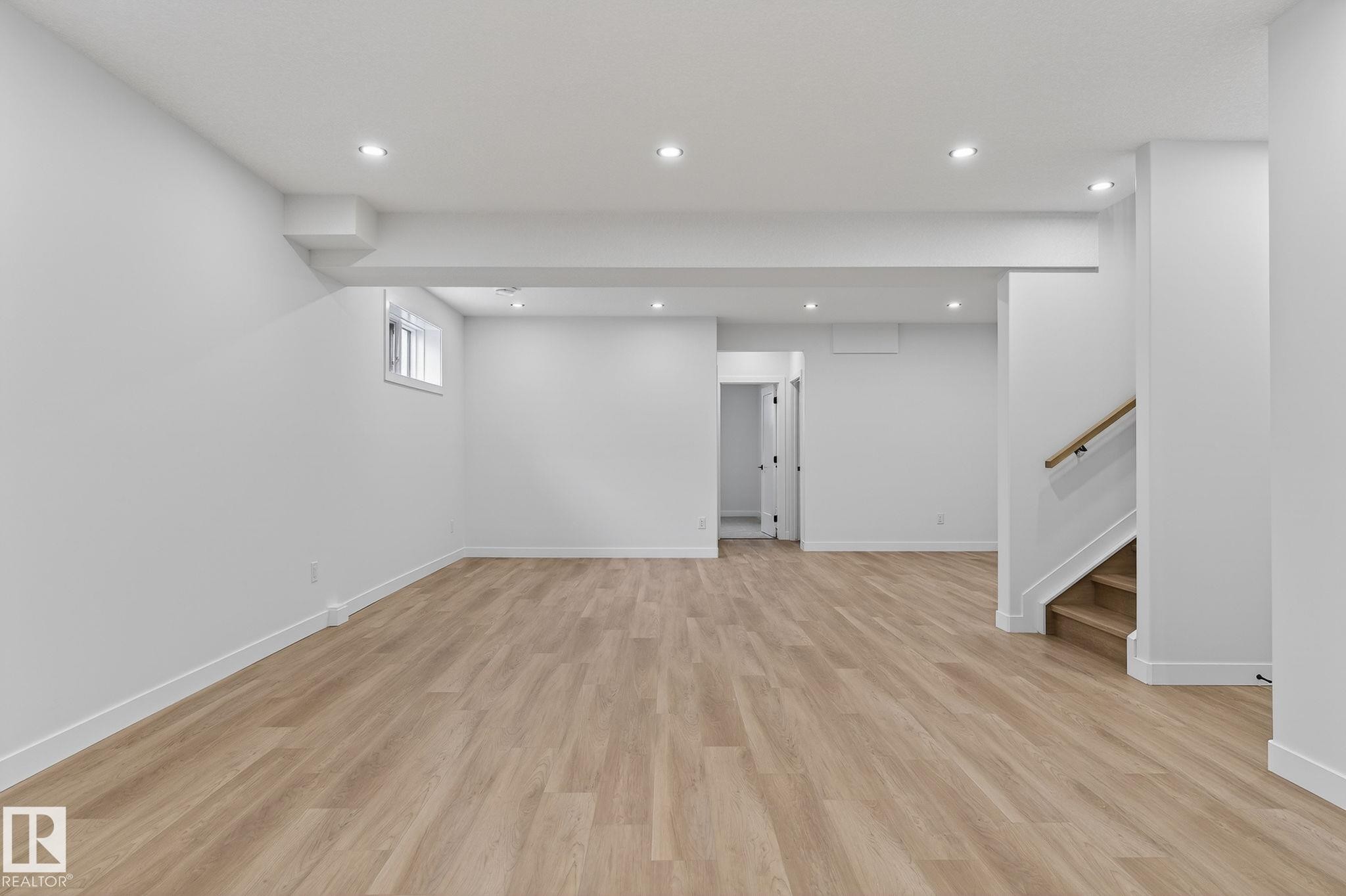 Basement featuring light wood finished floors and recessed lighting - 3318 Chickadee Drive, Edmonton, AB - Indoor Photo Showing Other Room