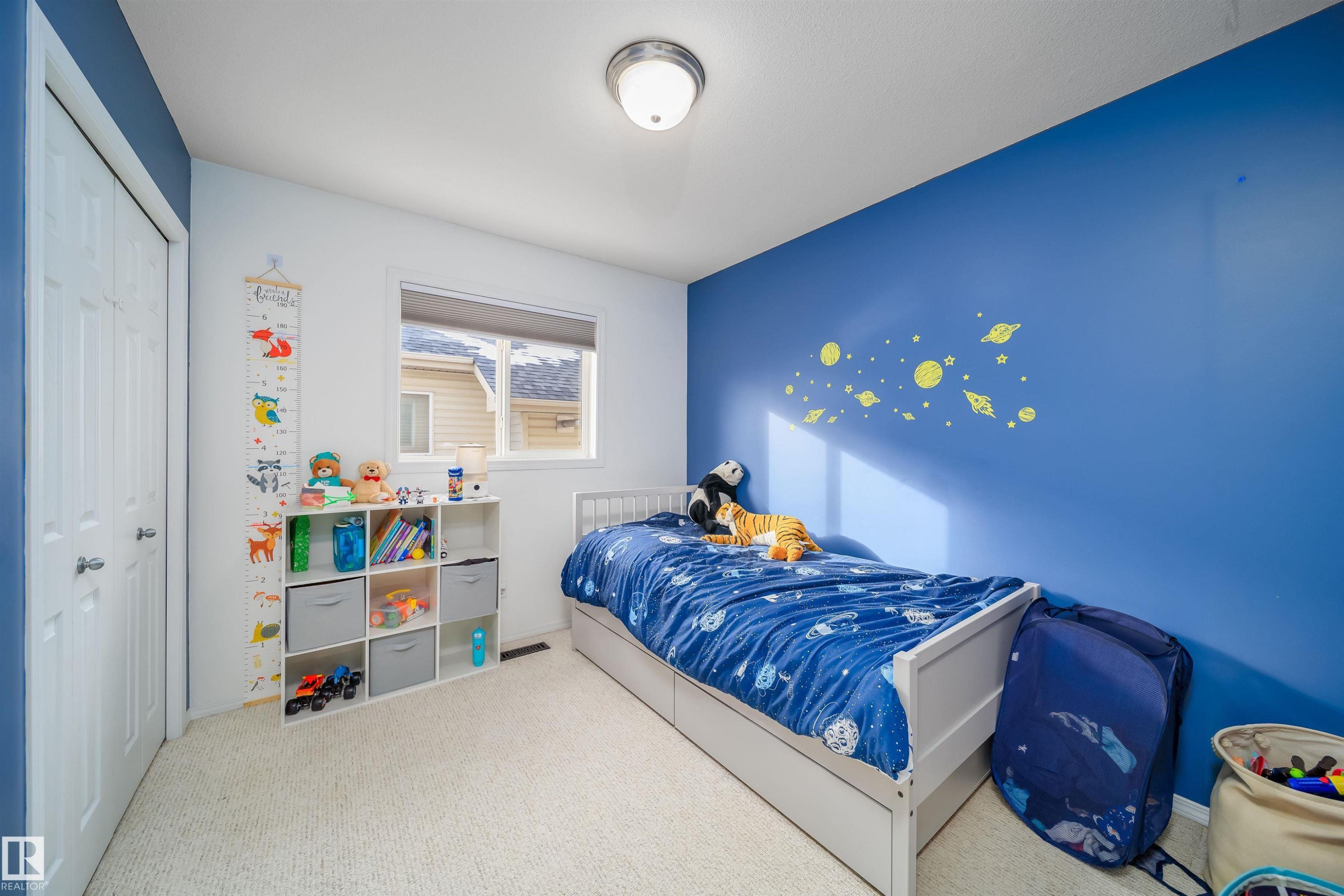 Carpeted bedroom with a closet and baseboards - 1179 Oakland Drive, Devon, AB - Indoor Photo Showing Bedroom