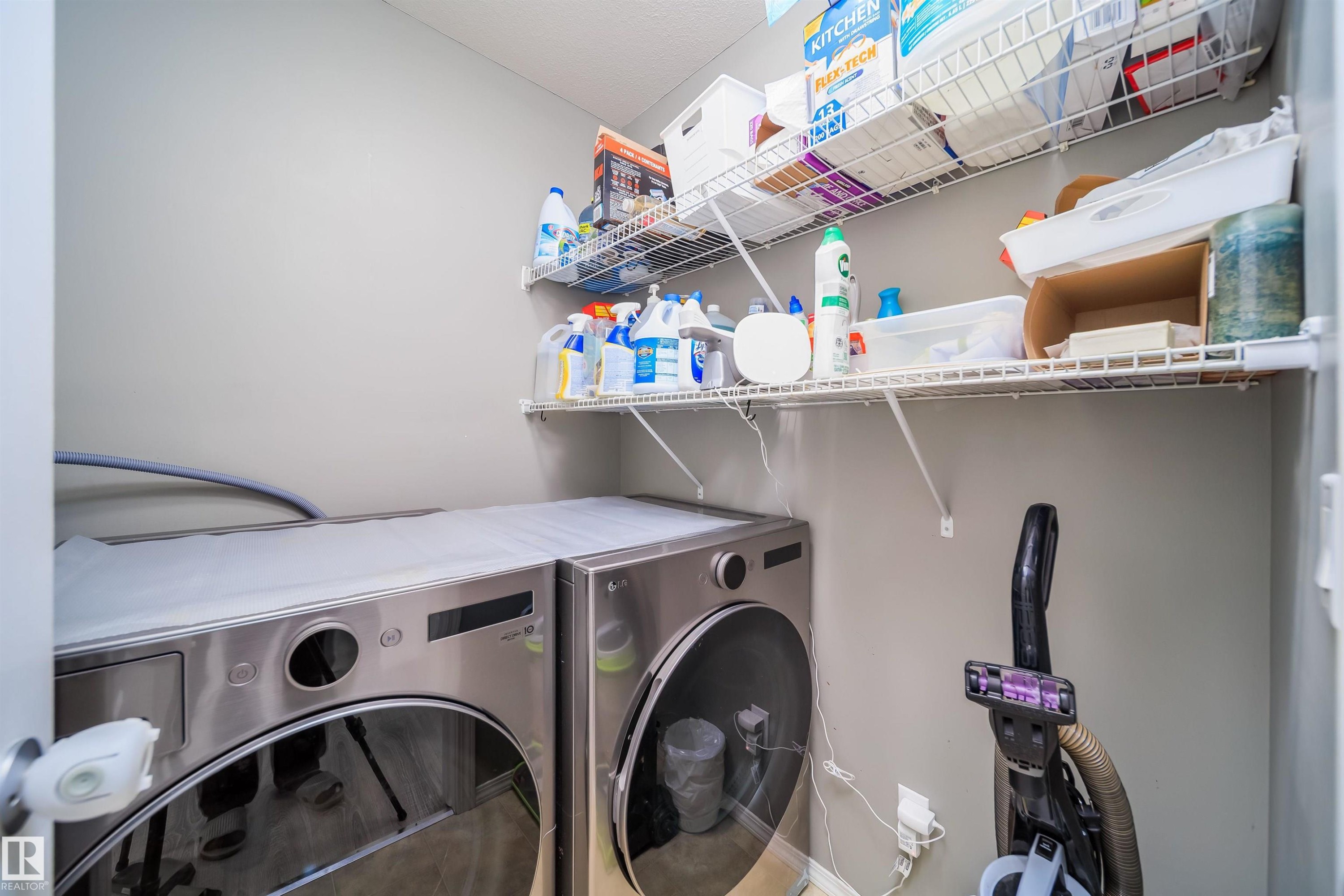 Laundry area with separate washer and dryer - 1179 Oakland Drive, Devon, AB - Indoor Photo Showing Laundry Room
