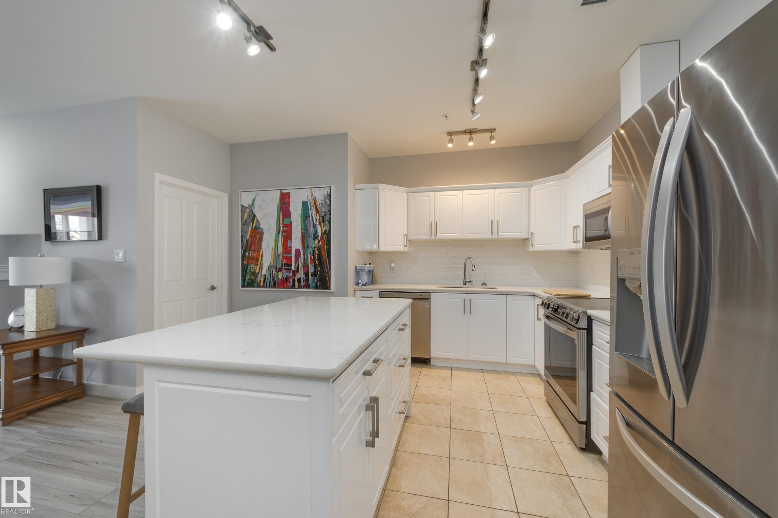 215 1003 Gault Boulevard, Edmonton, AB - Indoor Photo Showing Kitchen With Stainless Steel Kitchen