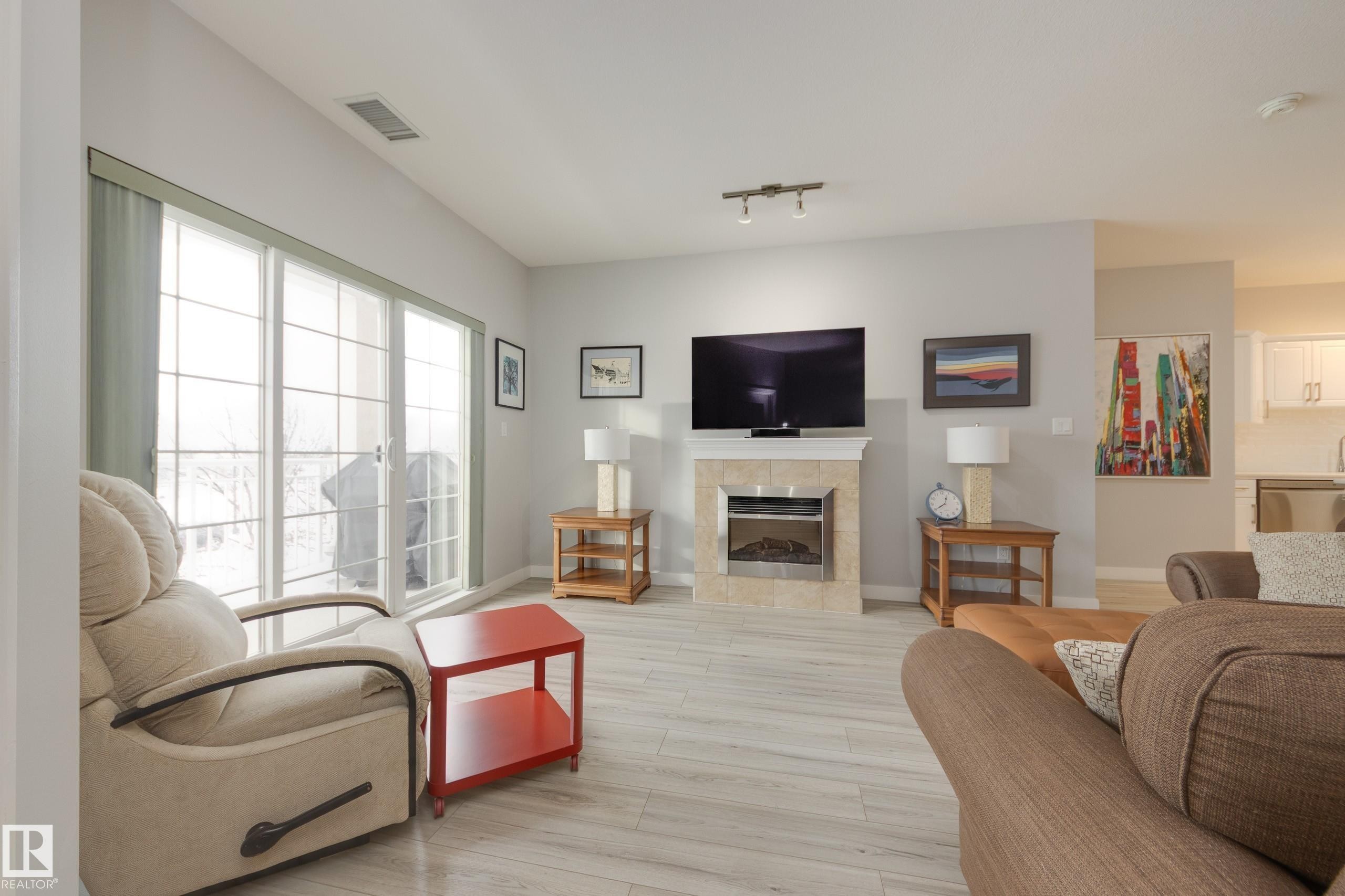 215 1003 Gault Boulevard, Edmonton, AB - Indoor Photo Showing Living Room With Fireplace