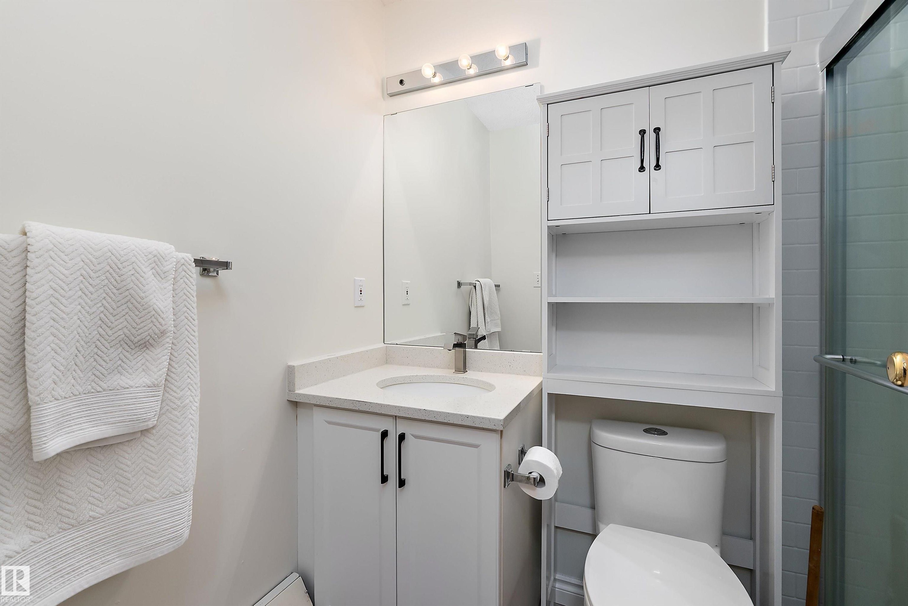 Full bath with vanity and an enclosed shower - 116 11620 9A Avenue, Edmonton, AB - Indoor Photo Showing Bathroom