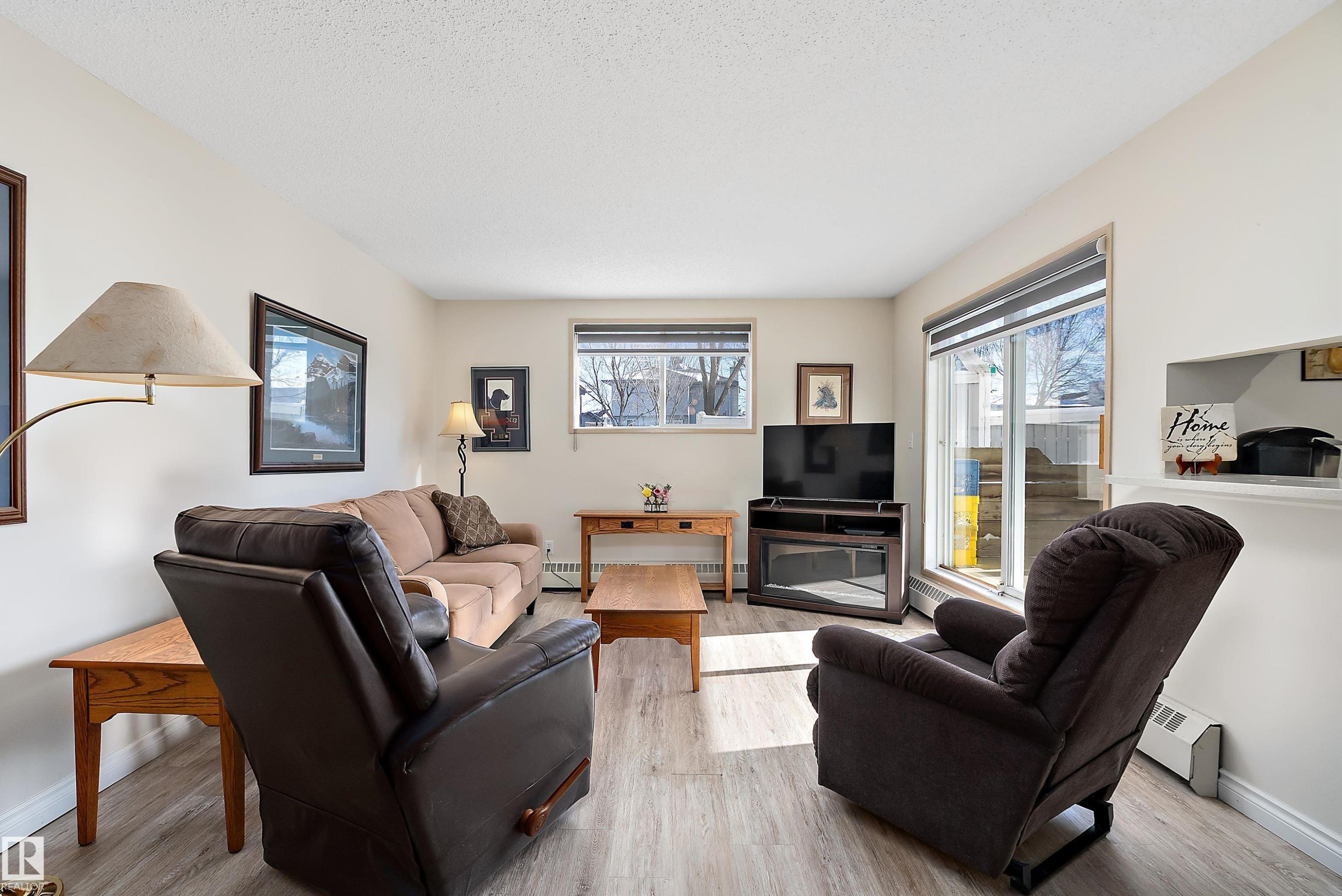 Living room featuring light flooring - 116 11620 9A Avenue, Edmonton, AB - Indoor Photo Showing Living Room