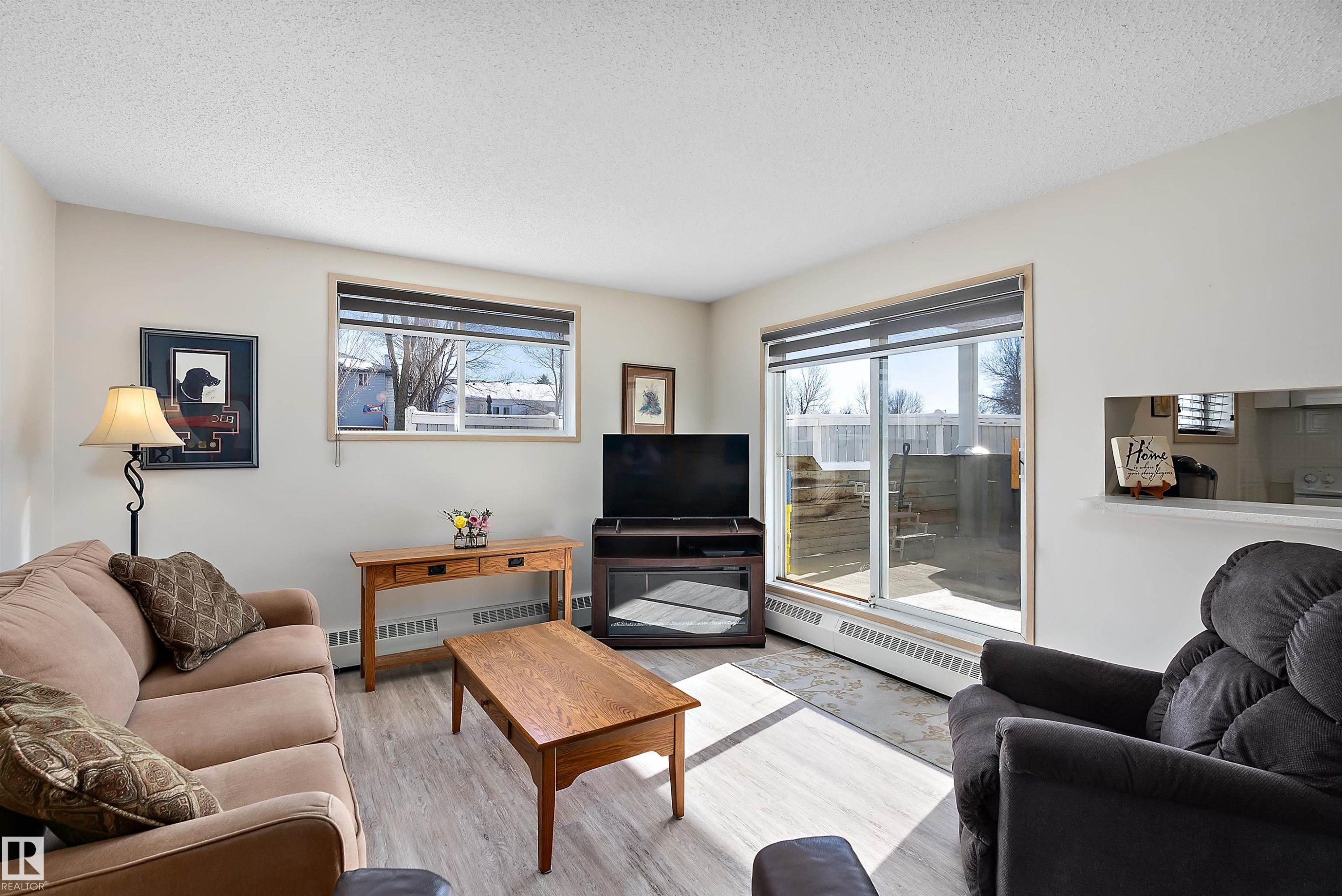 Living room featuring light flooring - 116 11620 9A Avenue, Edmonton, AB - Indoor Photo Showing Living Room