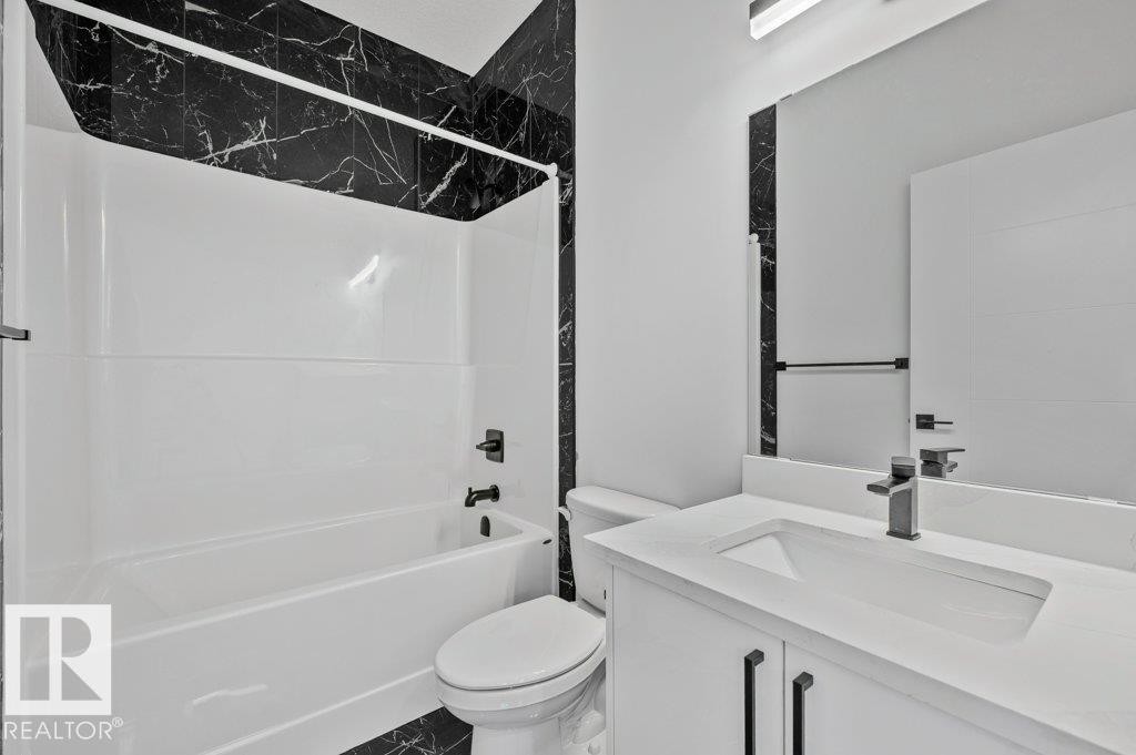 Full bath with vanity and shower / bath combination - Edmonton, AB - Indoor Photo Showing Bathroom