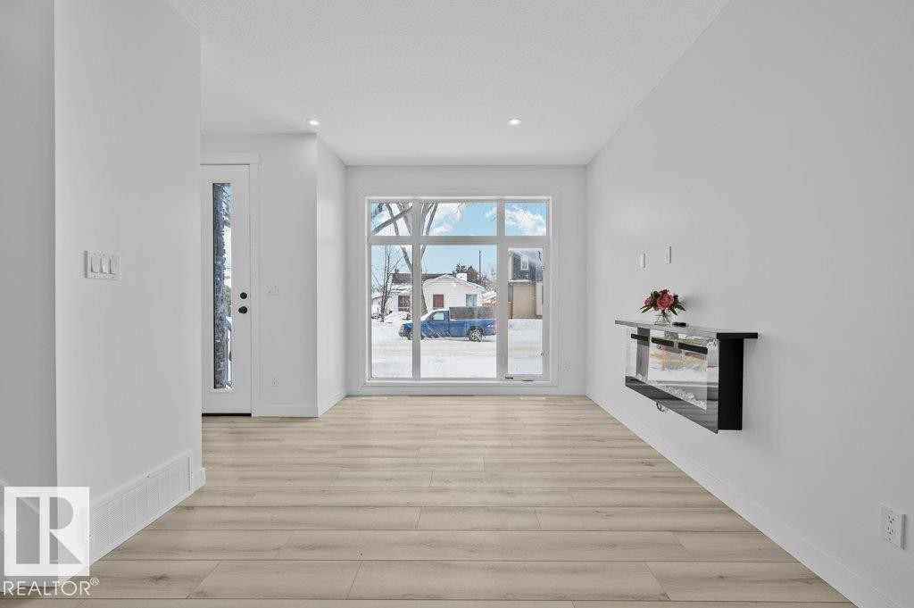 Corridor featuring light wood-style flooring and recessed lighting - Edmonton, AB - Indoor Photo Showing Other Room