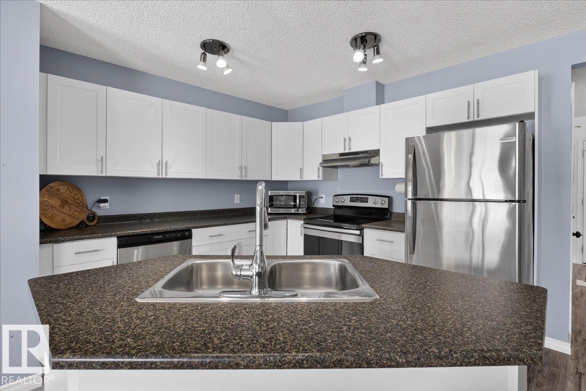 6828 159A Avenue, Edmonton, AB - Indoor Photo Showing Kitchen With Double Sink