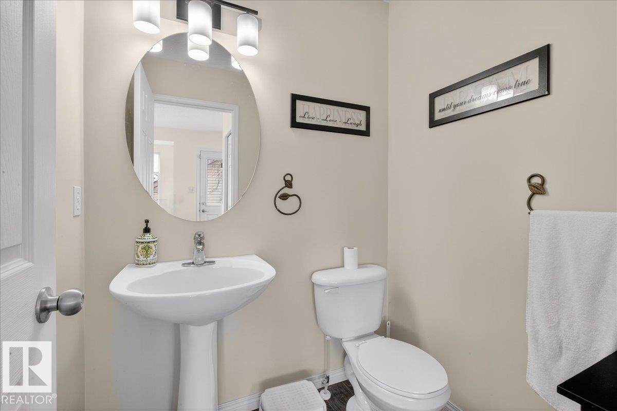 Half bathroom featuring toilet and baseboards - 4519 Turner Square, Edmonton, AB - Indoor Photo Showing Bathroom
