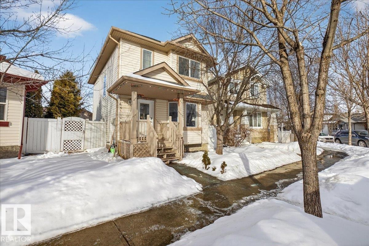 View of front of house featuring a gate and a wooden deck - 4519 Turner Square, Edmonton, AB - Outdoor With Facade