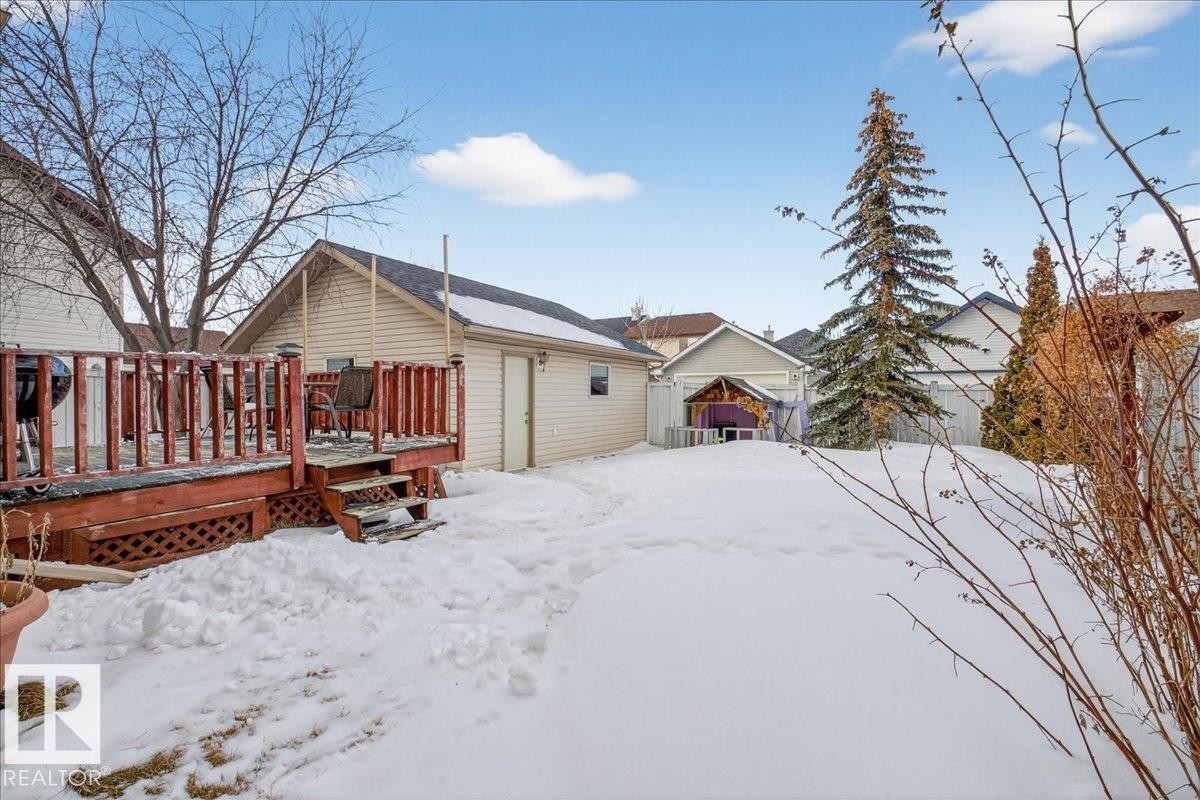 Snow covered property with a wooden deck - 4519 Turner Square, Edmonton, AB - Outdoor With Deck Patio Veranda