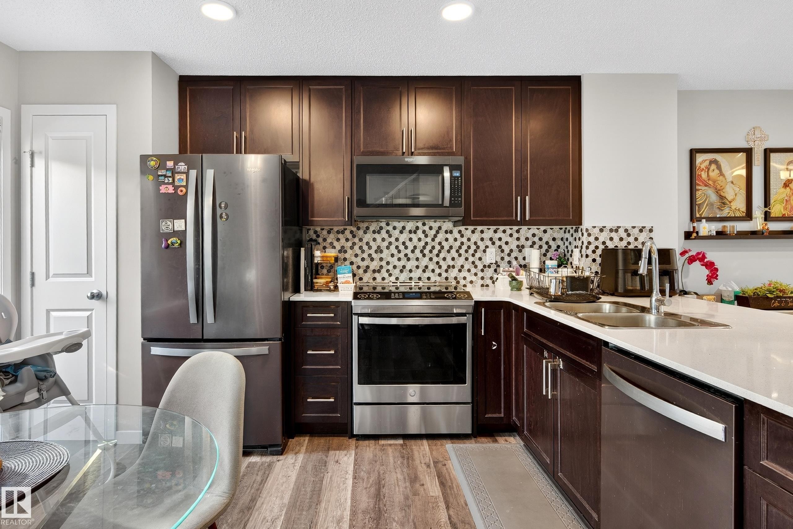 103 3305 Orchards Link, Edmonton, AB - Indoor Photo Showing Kitchen With Stainless Steel Kitchen With Double Sink