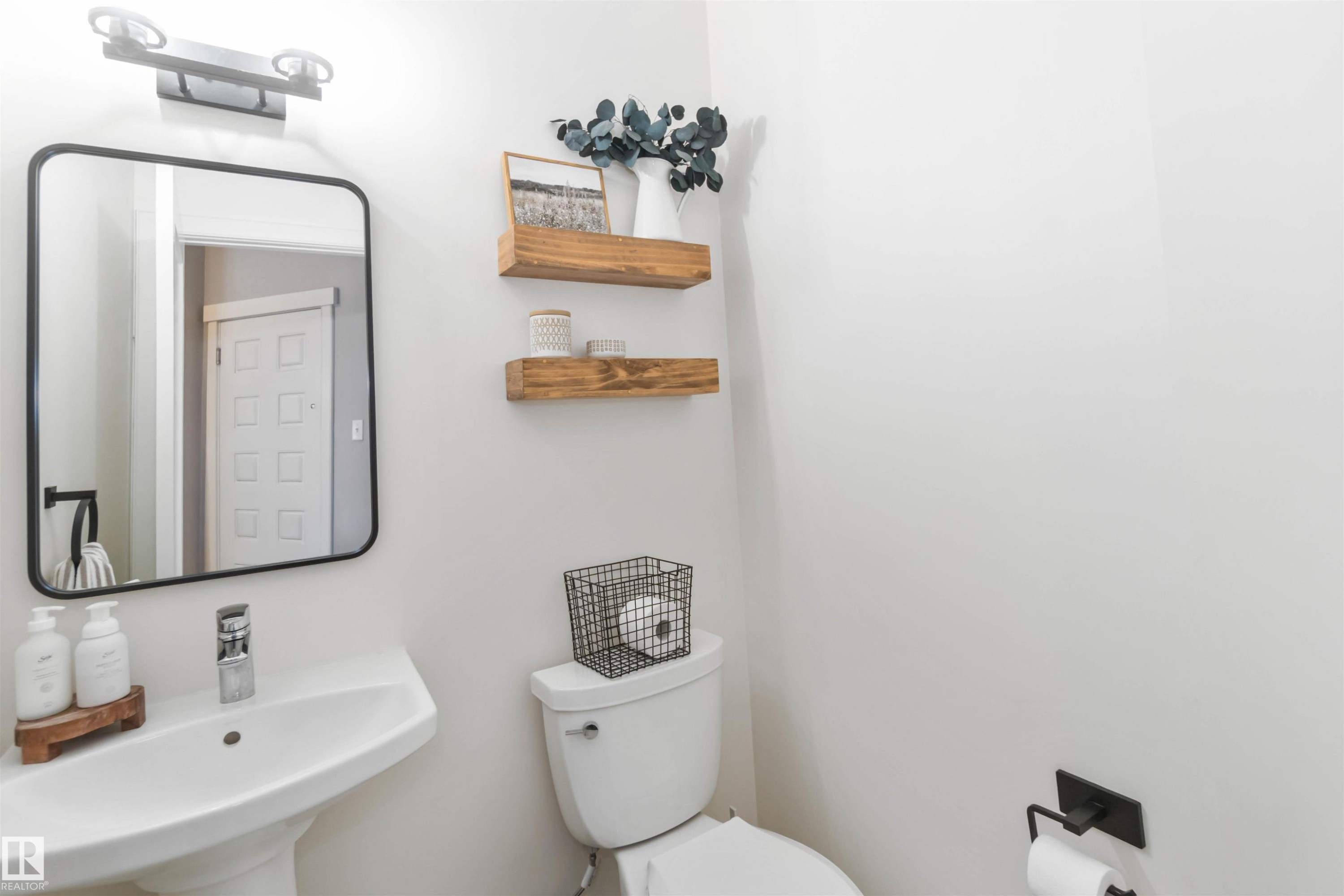 Bathroom with toilet and a sink - 17143 38 Street, Edmonton, AB - Indoor Photo Showing Bathroom