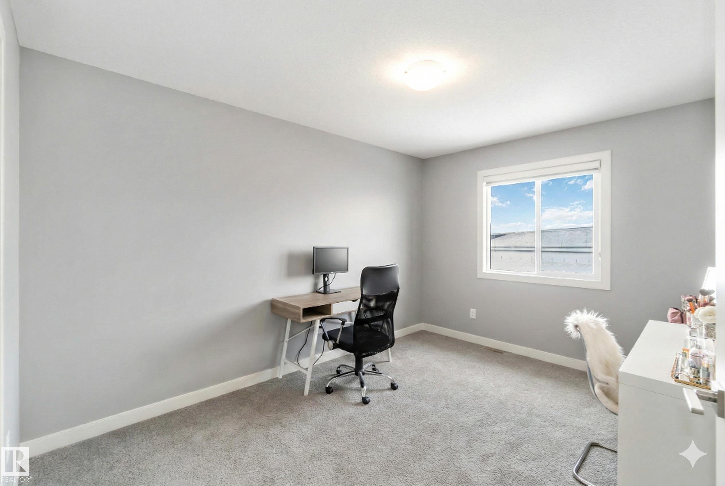 Office with baseboards and light colored carpet - 17143 38 Street, Edmonton, AB - Indoor Photo Showing Office