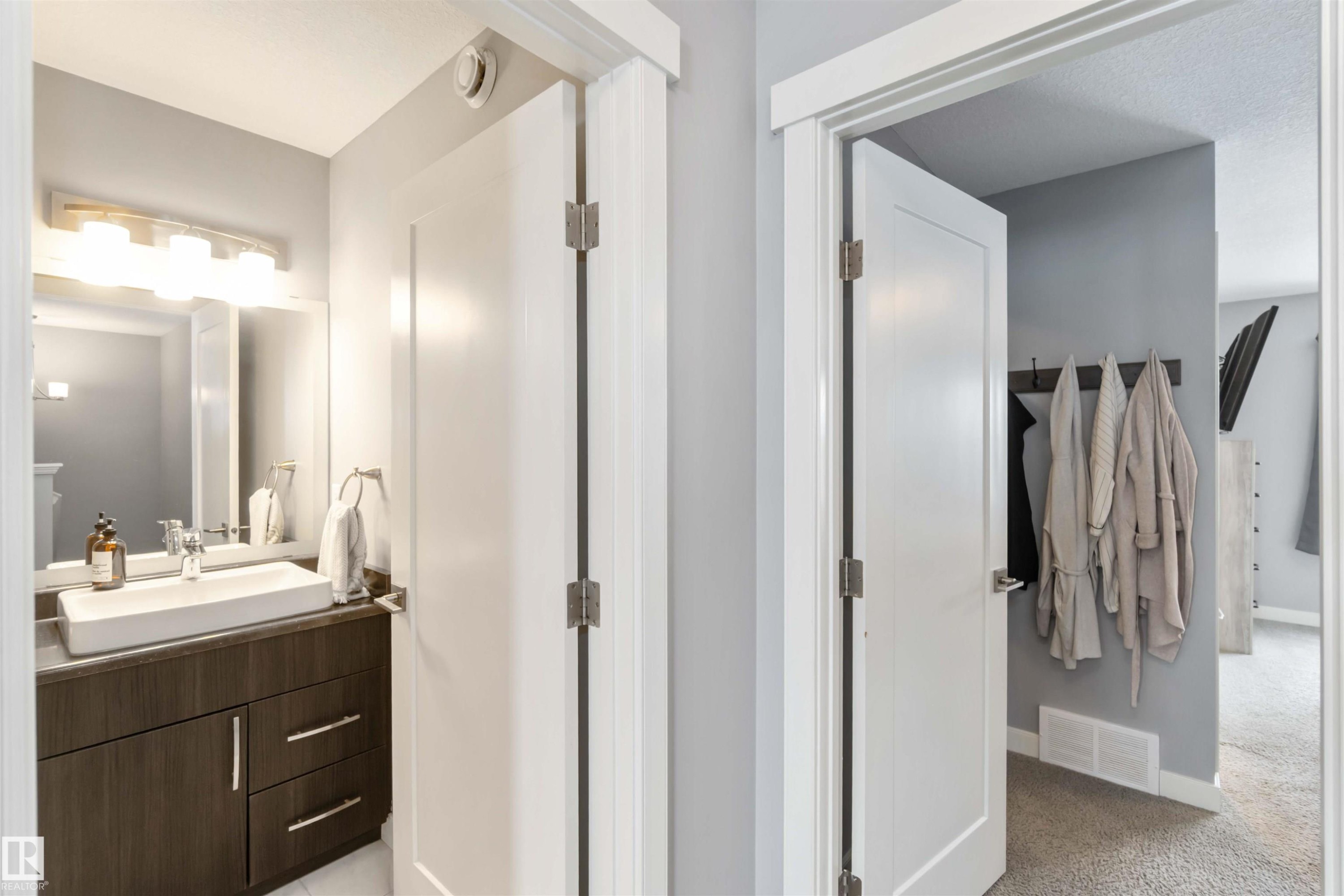 Bathroom with vanity and light colored carpet - 17143 38 Street, Edmonton, AB - Indoor Photo Showing Bathroom