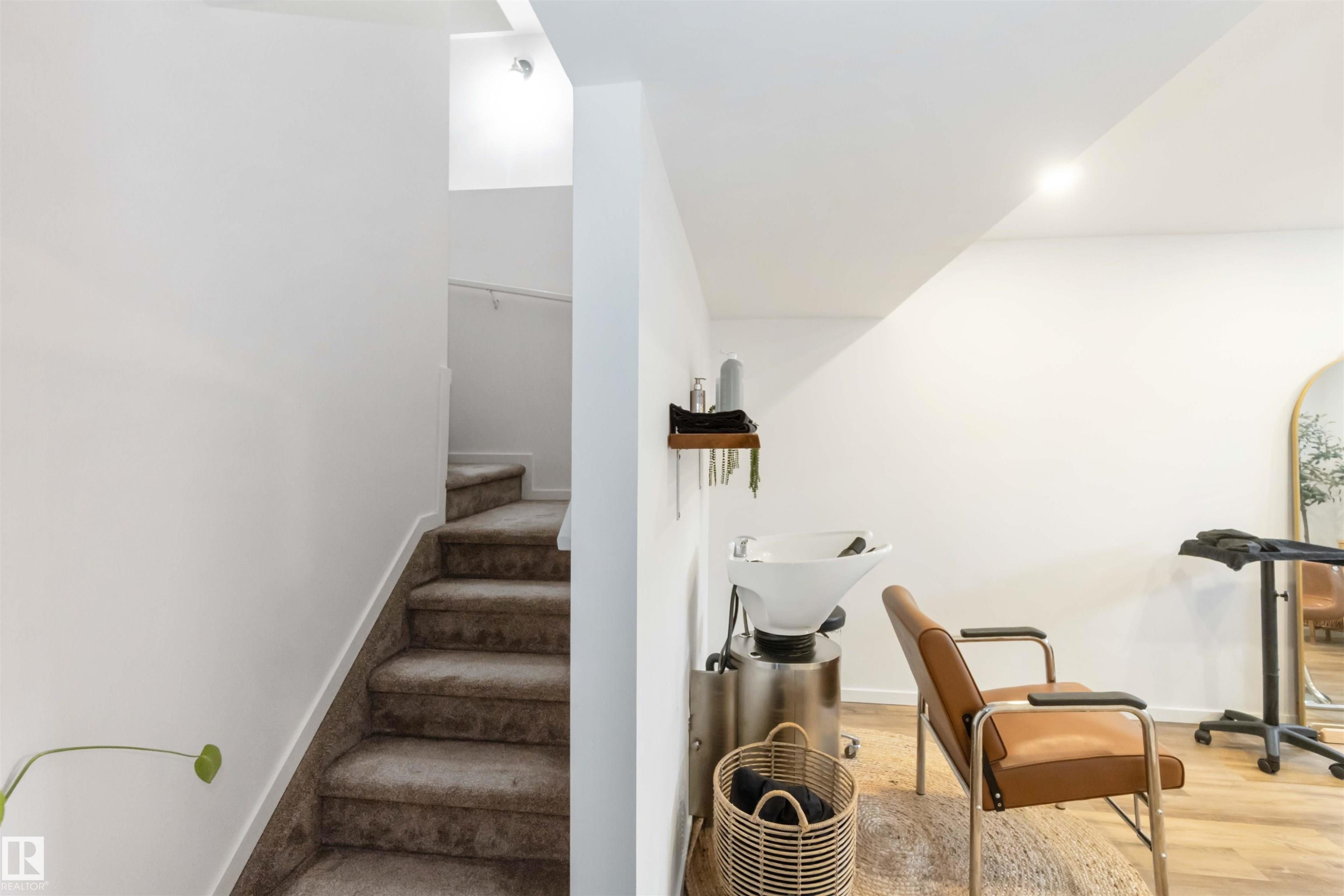Stairway featuring wood finished floors and baseboards - 17143 38 Street, Edmonton, AB - Indoor Photo Showing Other Room