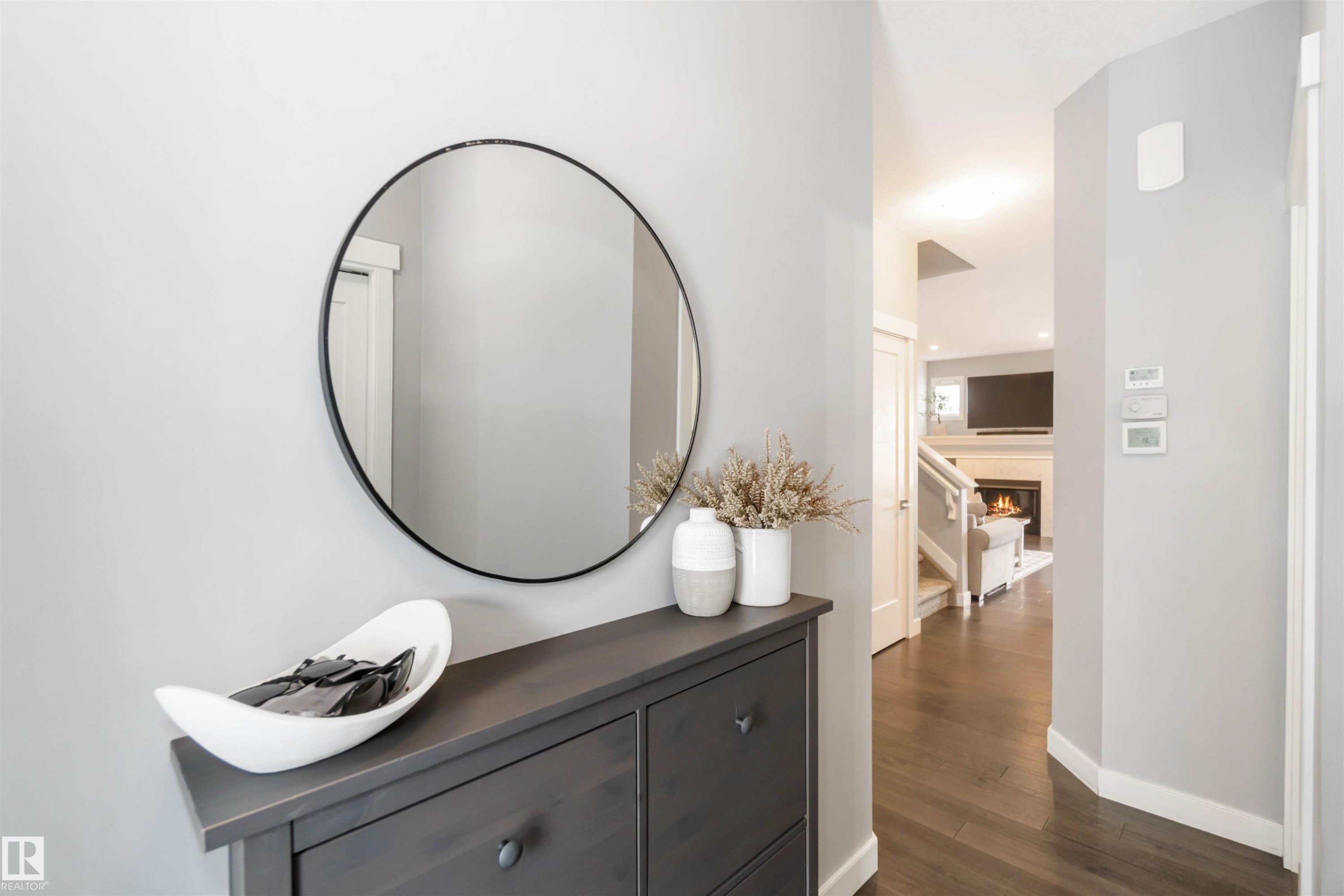 Hall featuring dark wood-style flooring and baseboards - 17143 38 Street, Edmonton, AB - Indoor