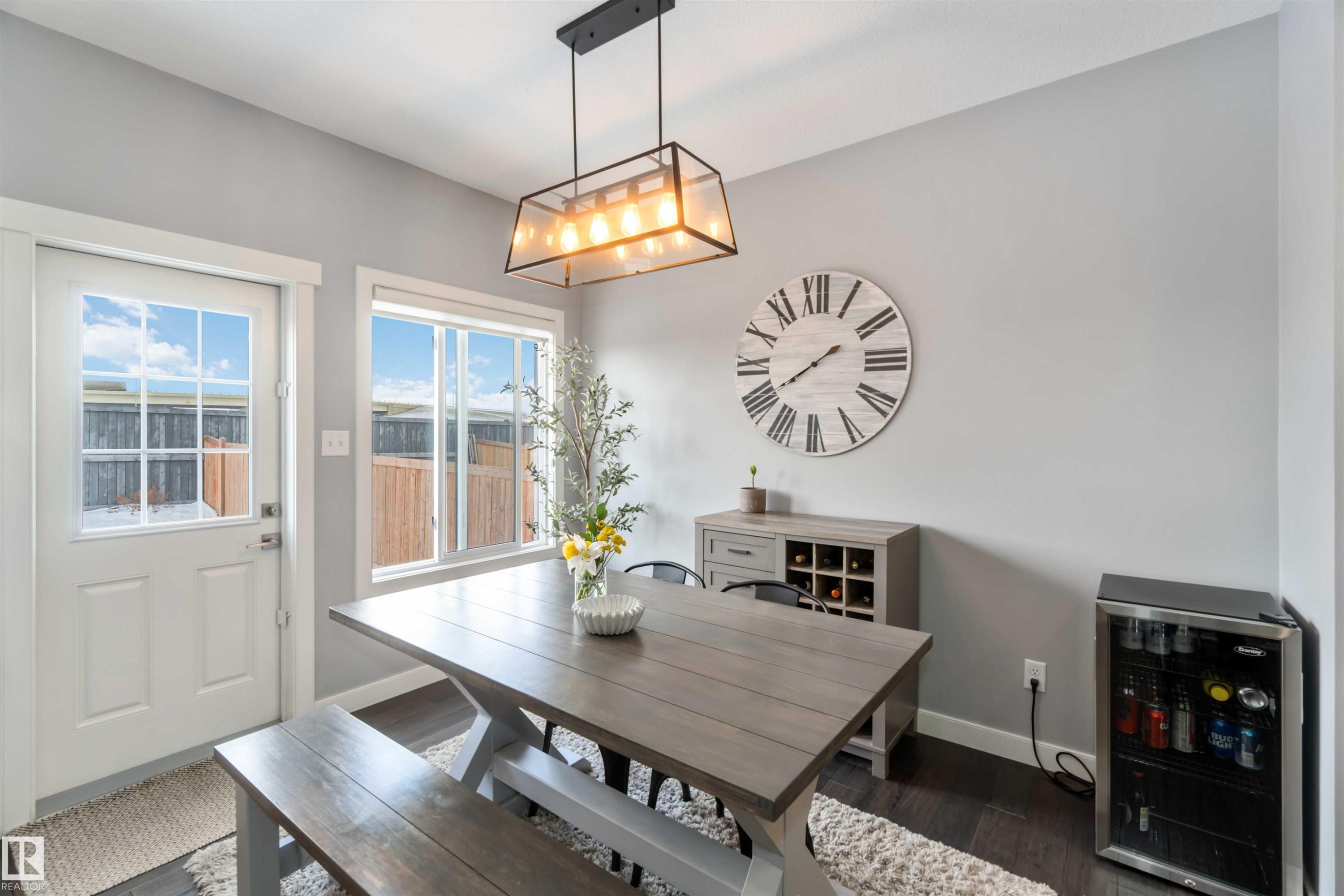 Dining room with dark wood-type flooring and beverage cooler - 17143 38 Street, Edmonton, AB - Indoor Photo Showing Dining Room