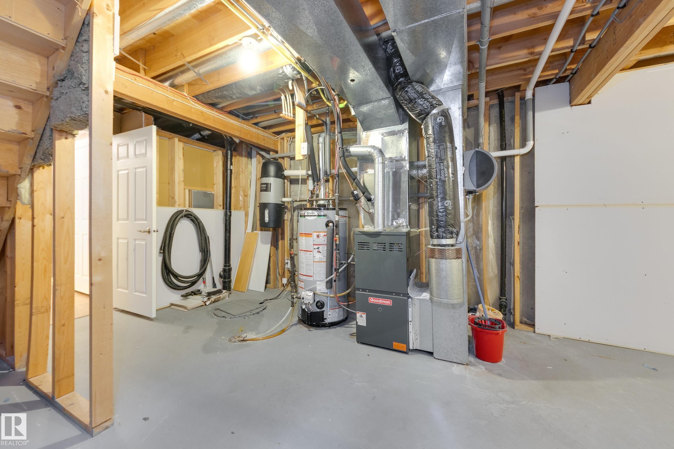 Unfinished below grade area featuring gas water heater and heating unit - 9916 178 Avenue, Edmonton, AB - Indoor Photo Showing Basement