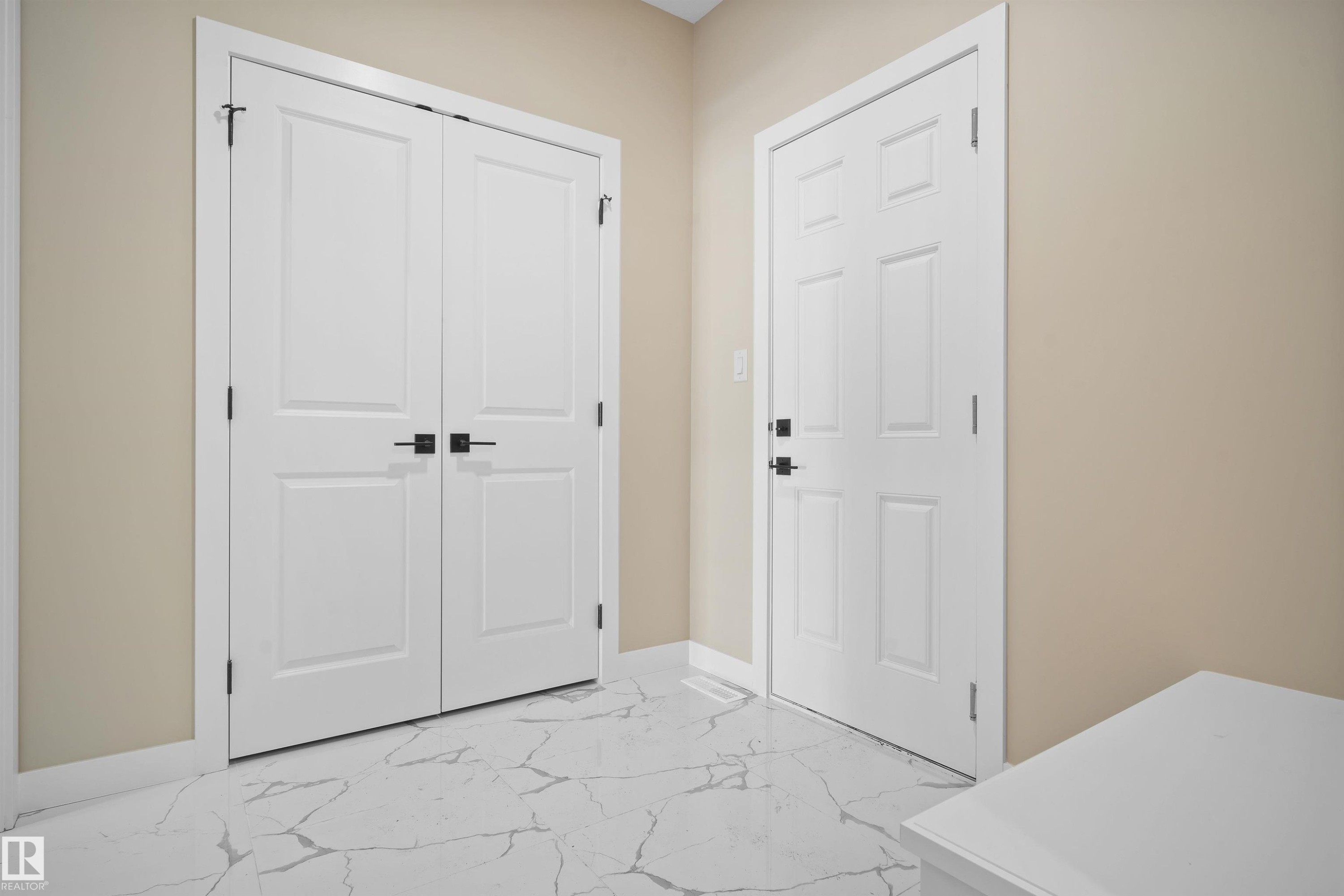 Foyer entrance featuring light marble finish floors and baseboards - 3910 41 Avenue, Beaumont, AB - Indoor Photo Showing Other Room