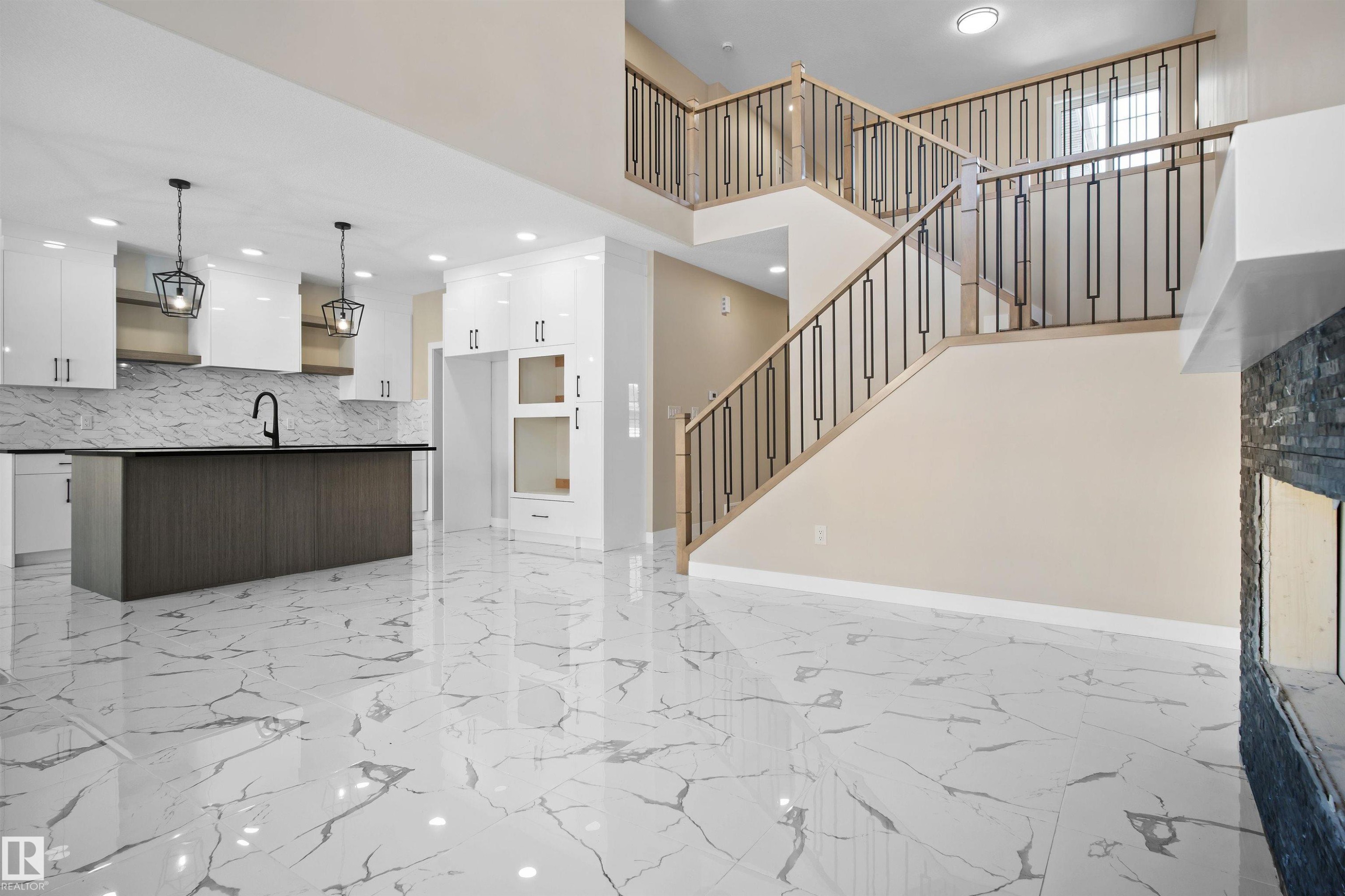 Unfurnished living room with recessed lighting and a high ceiling - 3910 41 Avenue, Beaumont, AB - Indoor Photo Showing Kitchen With Upgraded Kitchen