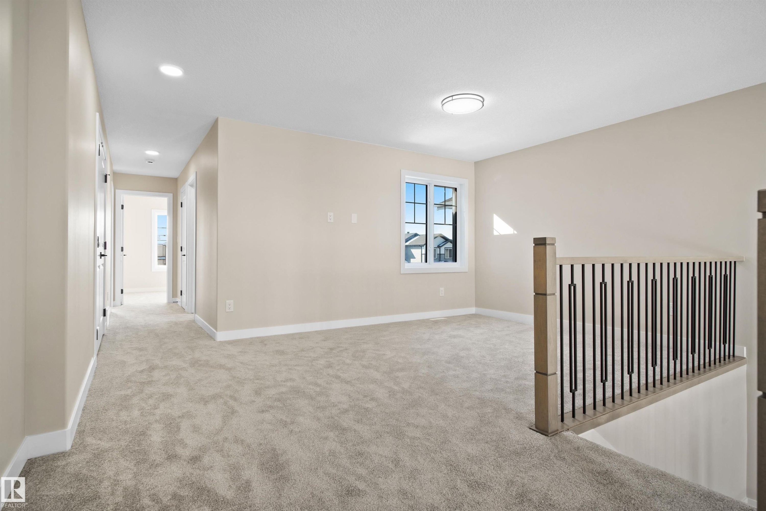 Empty room with light colored carpet and recessed lighting - 3910 41 Avenue, Beaumont, AB - Indoor Photo Showing Other Room