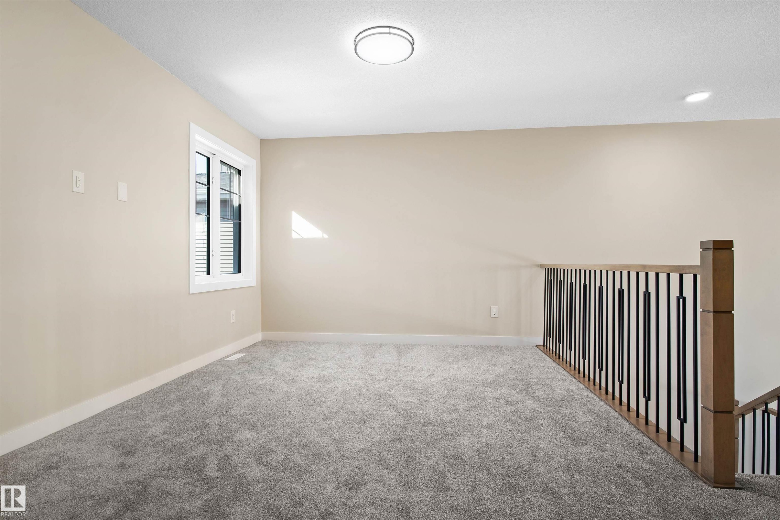 Carpeted empty room featuring baseboards - 3910 41 Avenue, Beaumont, AB - Indoor Photo Showing Other Room