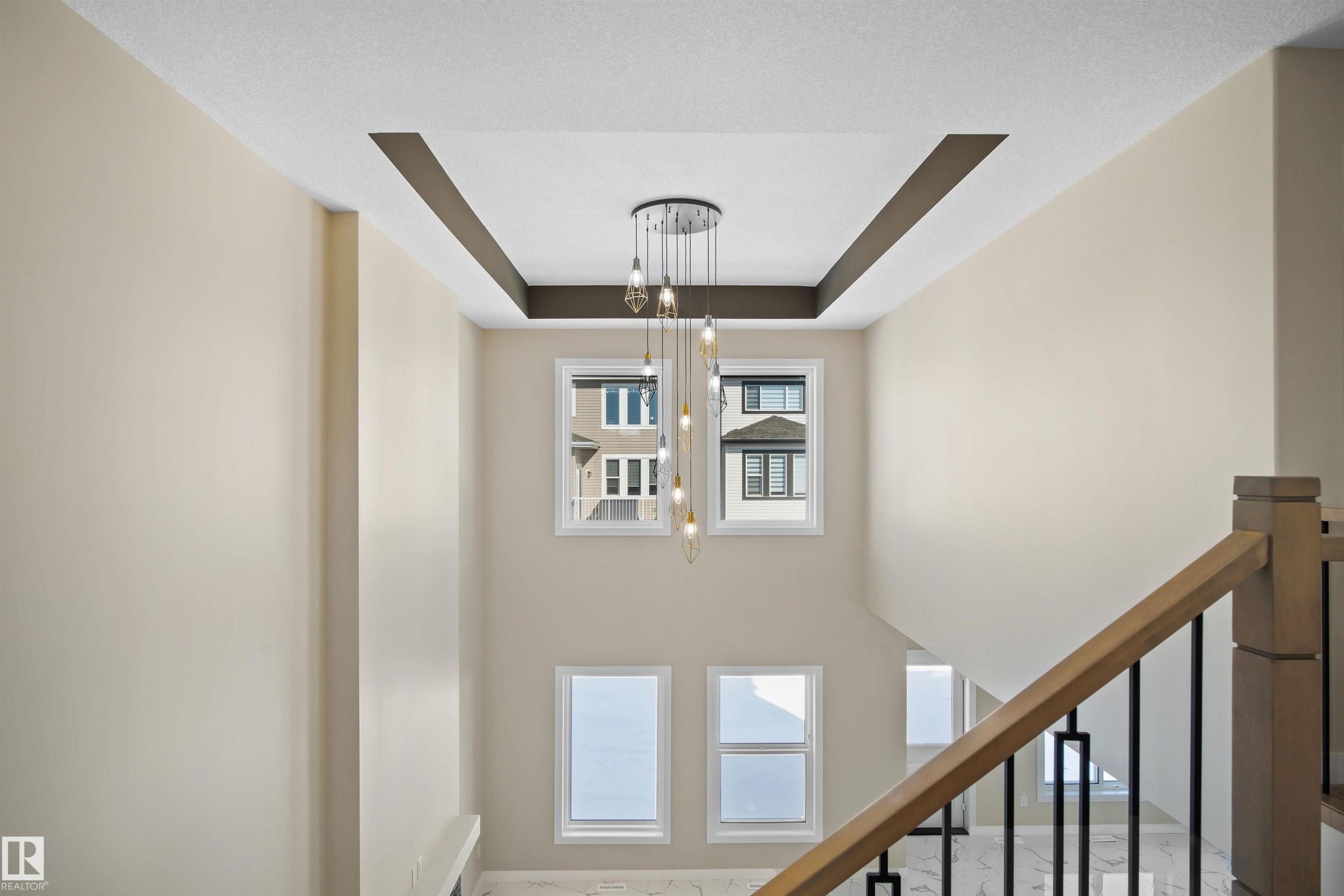 Stairway featuring a raised ceiling - 3910 41 Avenue, Beaumont, AB - Indoor Photo Showing Other Room