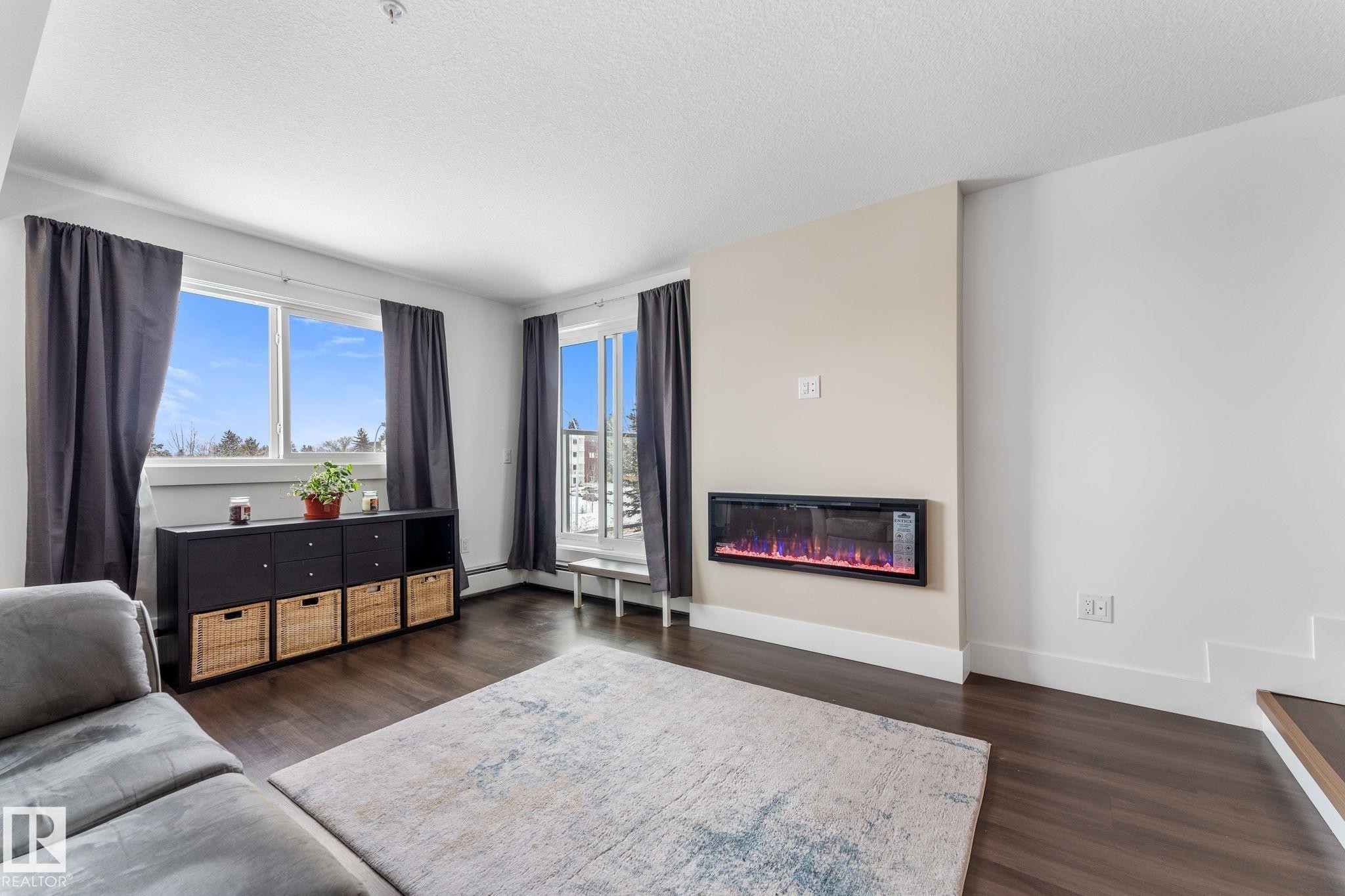 302 9504 182 Street, Edmonton, AB - Indoor Photo Showing Living Room With Fireplace