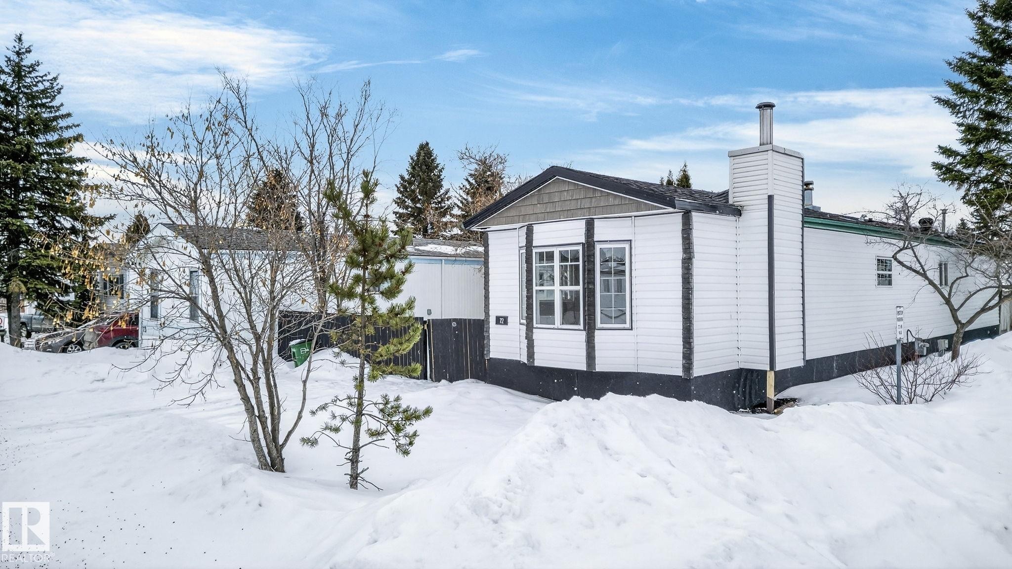 View of snowy exterior featuring a chimney - 72 Evergreen Park, Edmonton, AB - Outdoor