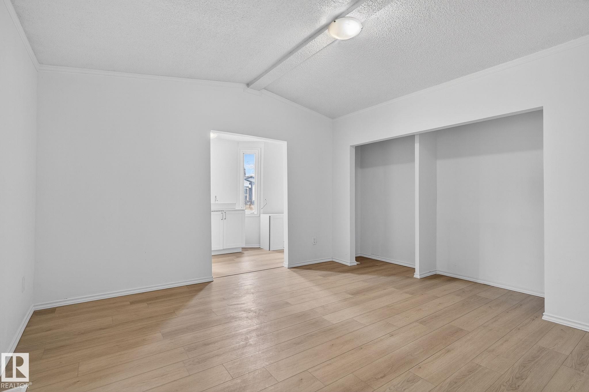 Unfurnished bedroom with light wood-style floors and a closet - 72 Evergreen Park, Edmonton, AB - Indoor Photo Showing Other Room