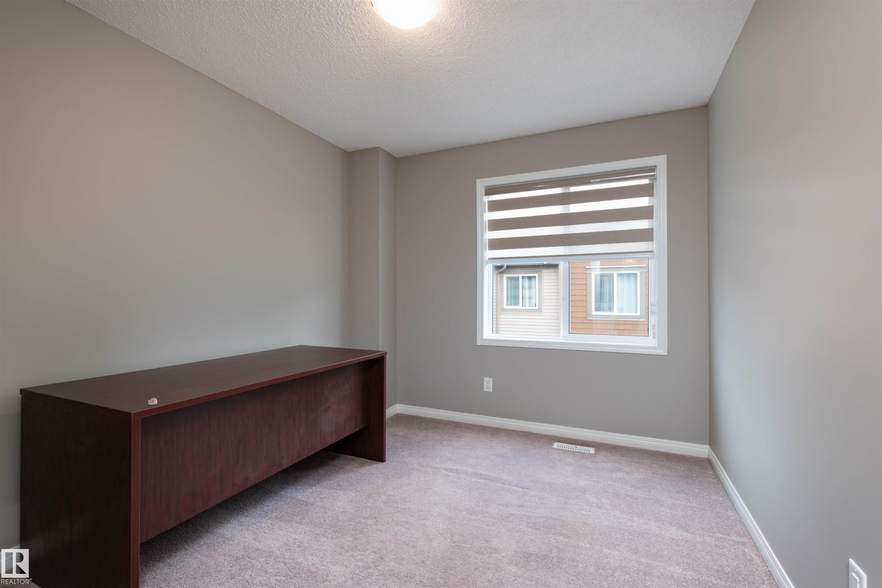 Bedroom 2 - 105 2072 Wonnacott Way, Edmonton, AB - Indoor Photo Showing Other Room