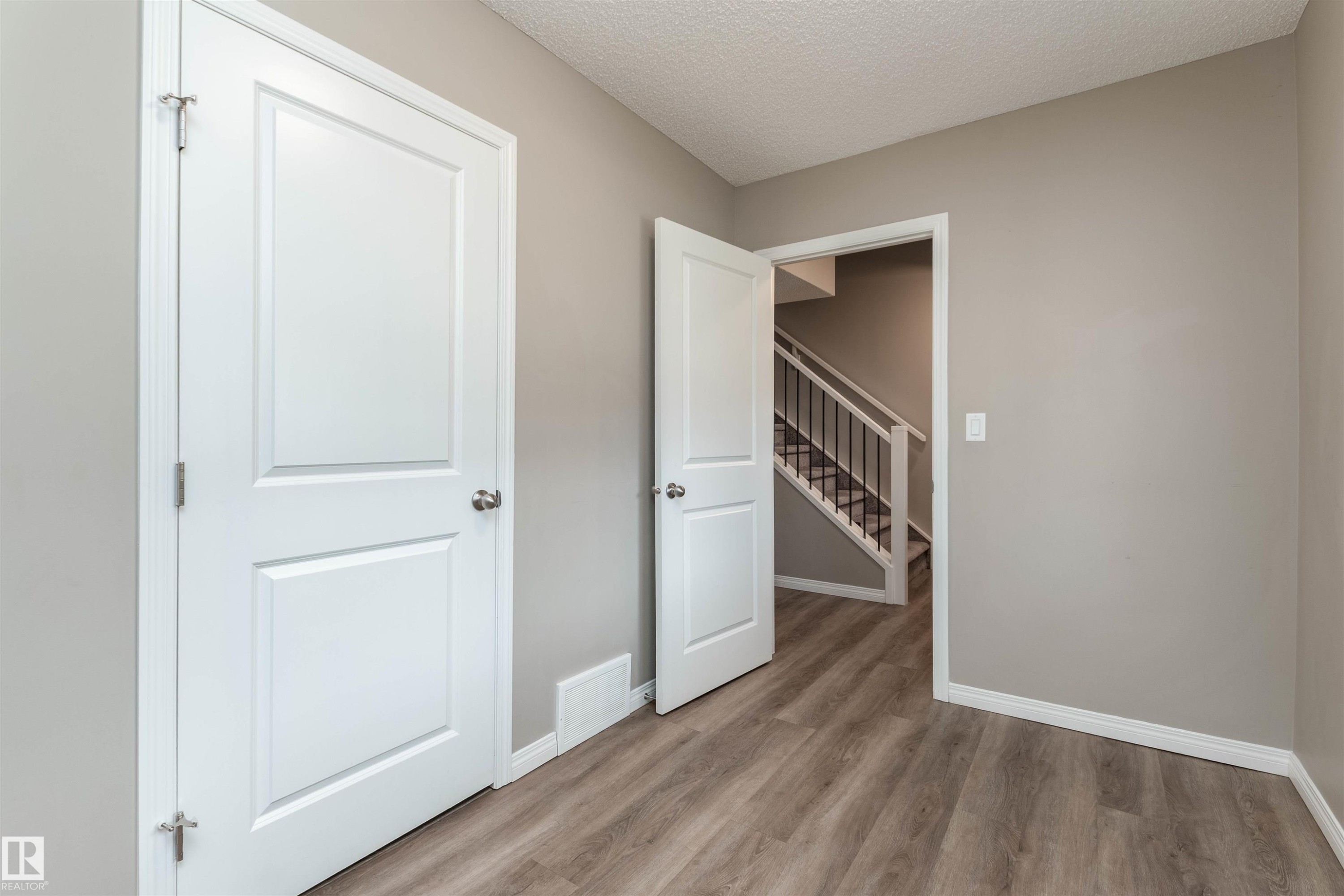 Den with door to Utility room - 105 2072 Wonnacott Way, Edmonton, AB - Indoor Photo Showing Other Room