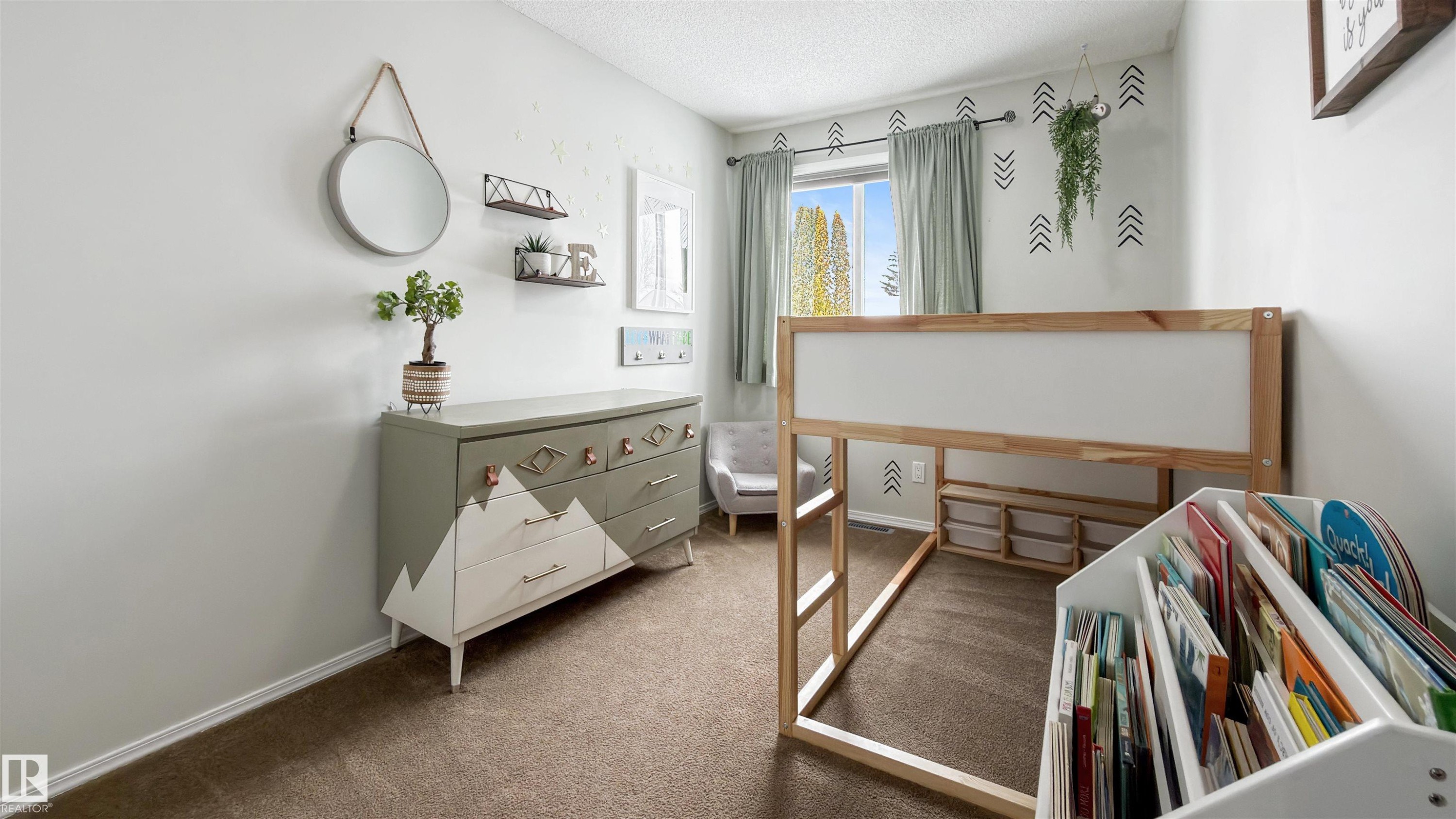 Bedroom with dark colored carpet and a textured ceiling - 7 Chungo Drive, Devon, AB - Indoor