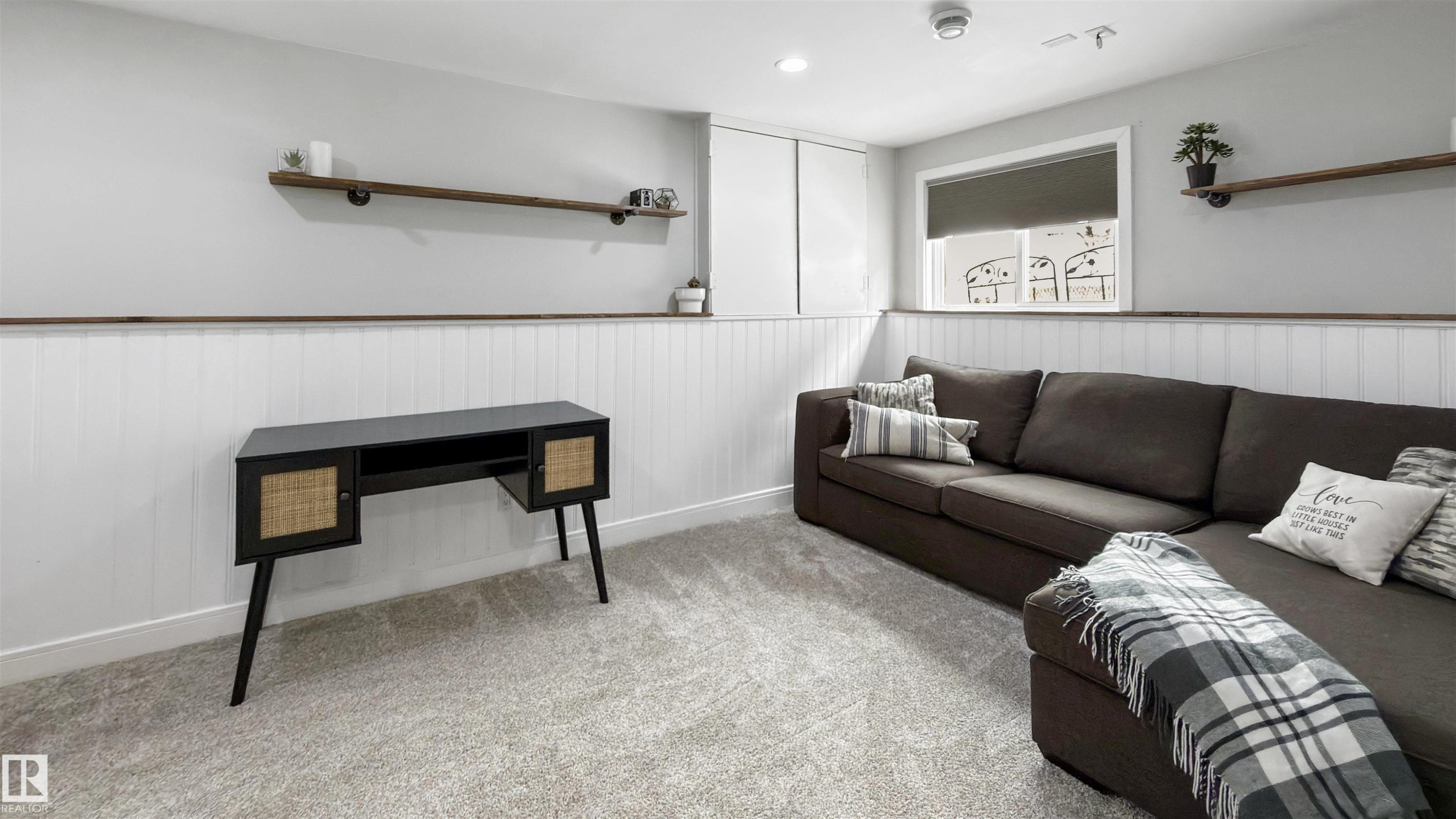Living area with light colored carpet, a wainscoted wall, and recessed lighting - 7 Chungo Drive, Devon, AB - Indoor
