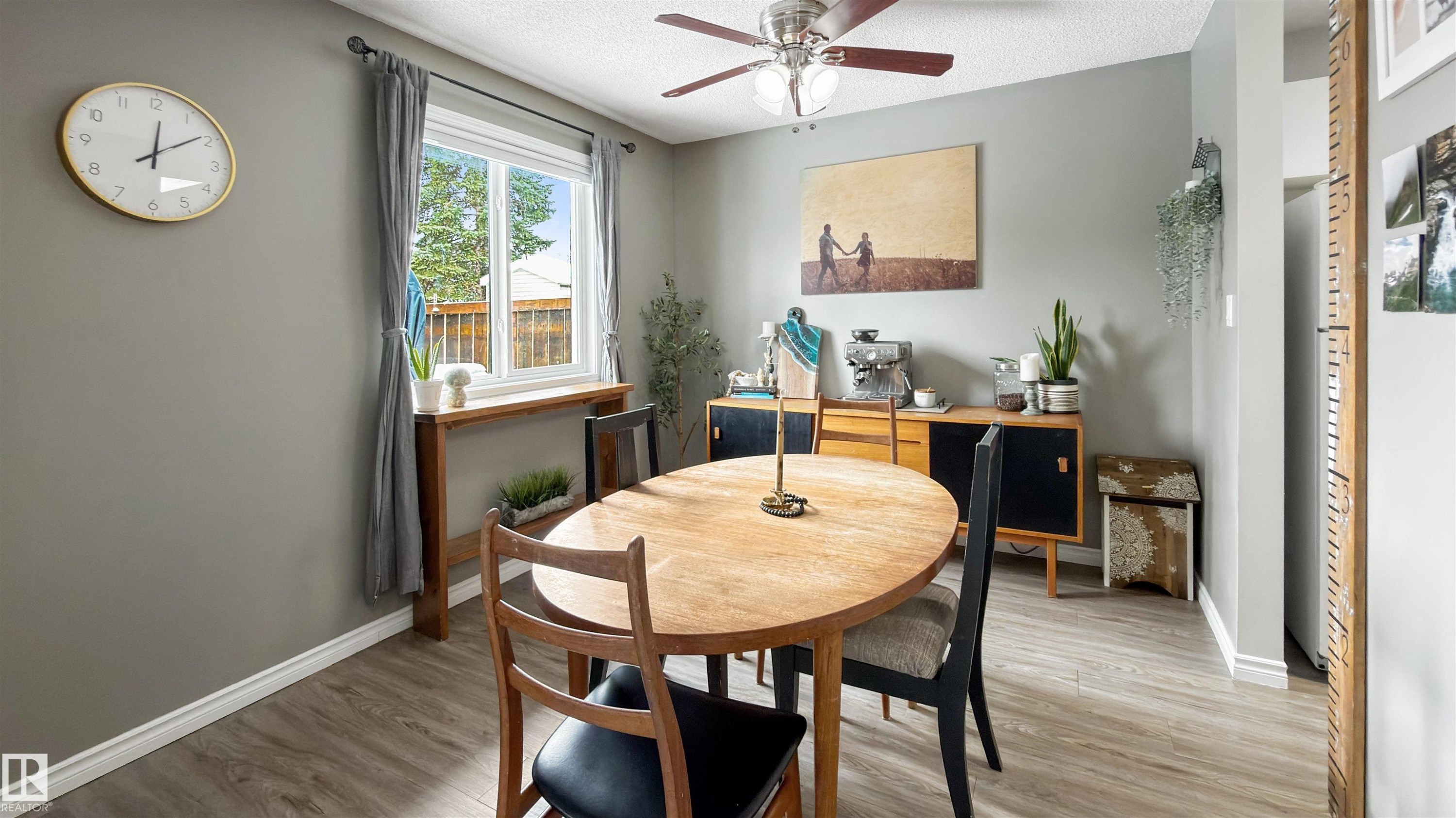 Dining room with wood finished floors, ceiling fan, and a textured ceiling - 7 Chungo Drive, Devon, AB - Indoor Photo Showing Dining Room