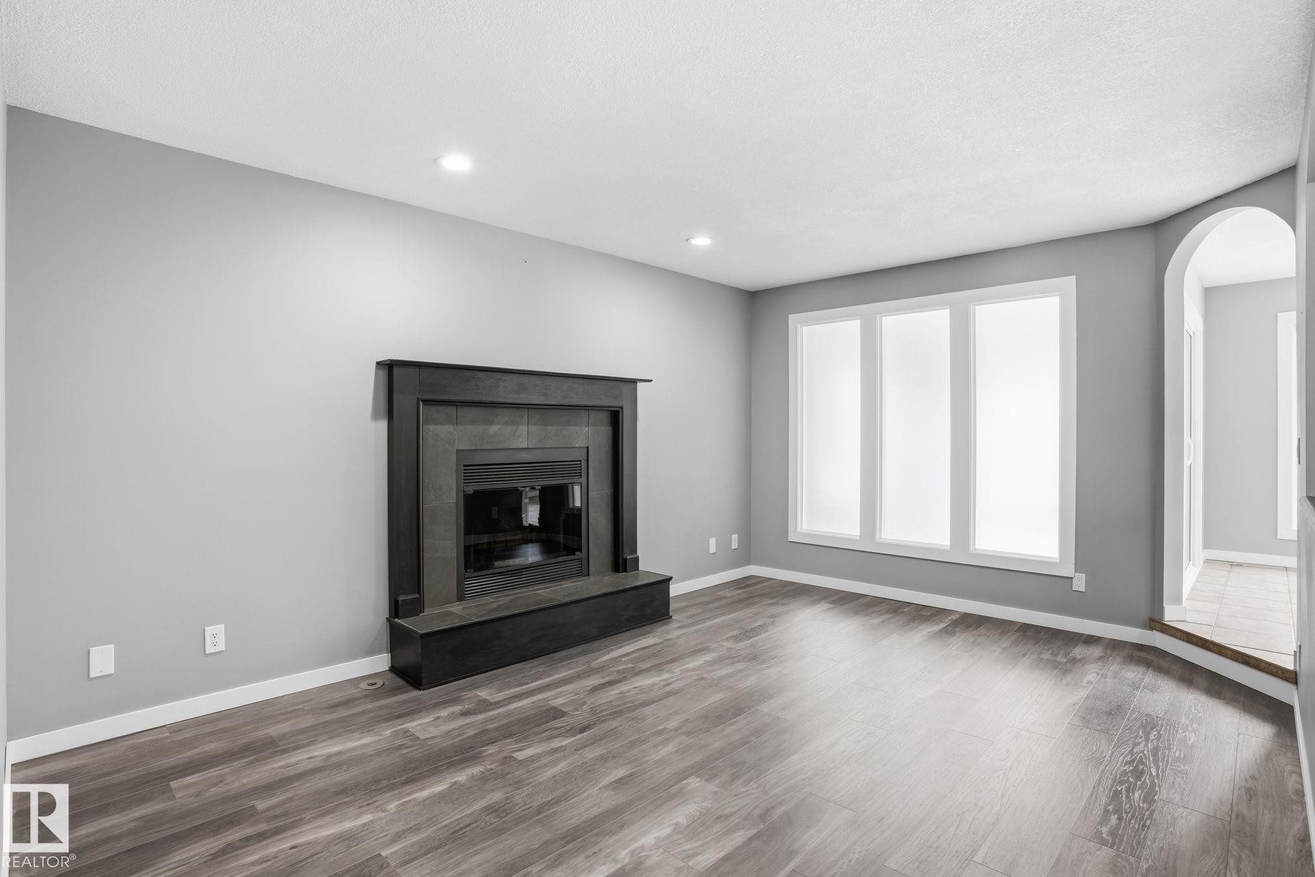 11019 10 Avenue, Edmonton, AB - Indoor Photo Showing Living Room With Fireplace