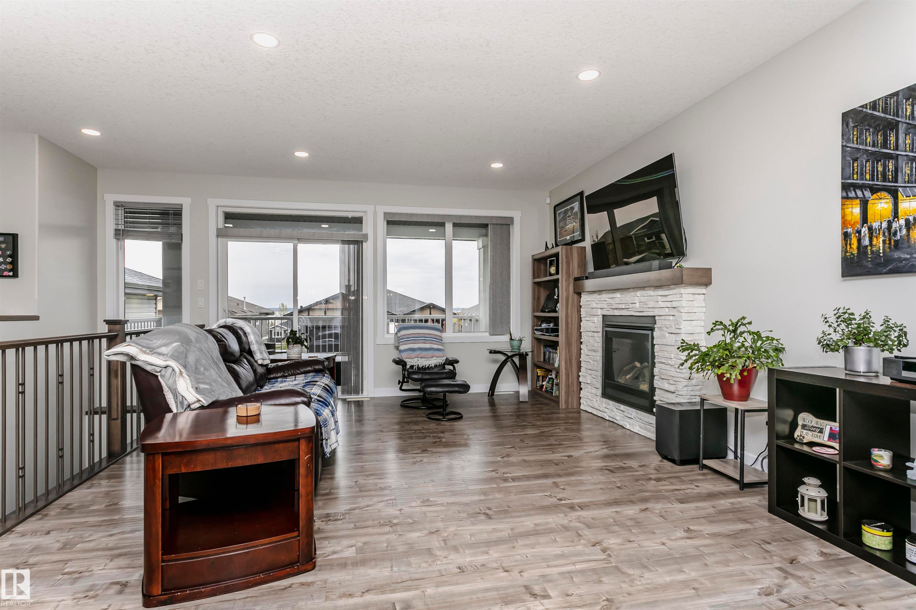 611 55101 Ste Anne Trail, Rural Lac Ste. Anne County, AB - Indoor Photo Showing Living Room With Fireplace